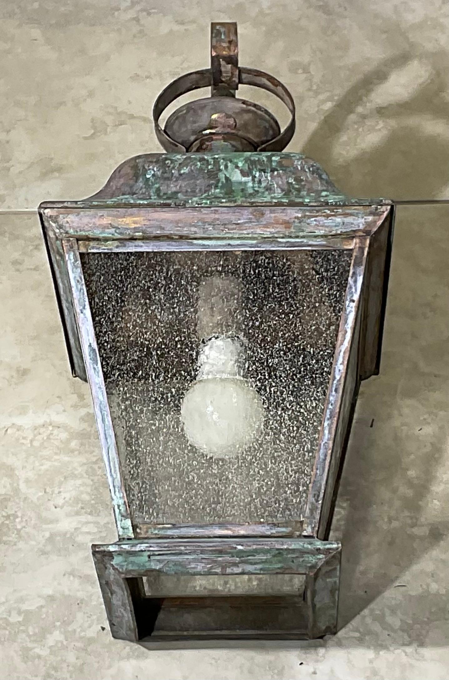 Elegant single wall lantern ,hand crafted from solid brass with one 60/watt light ,  four sides of textured glass. Beautiful patina.
 Suitable for wet locations, electrified and ready to use.
decorative lantern indoor or outdoor.