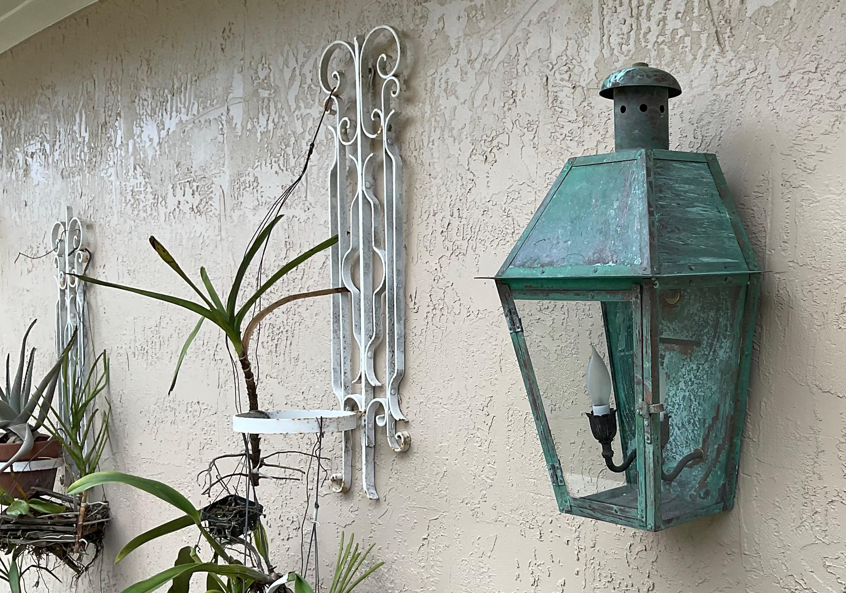 Single Wall lantern made of solid copper , originally  was gas lantern and converted to be electric wall light . Two 60/watt light , great look ,beautiful oxidized patina .
 Suitable for wet location.