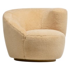Single Vladimir Kagan Nautilus Swivel Chair in Hand Sewn Butterscotch Shearling