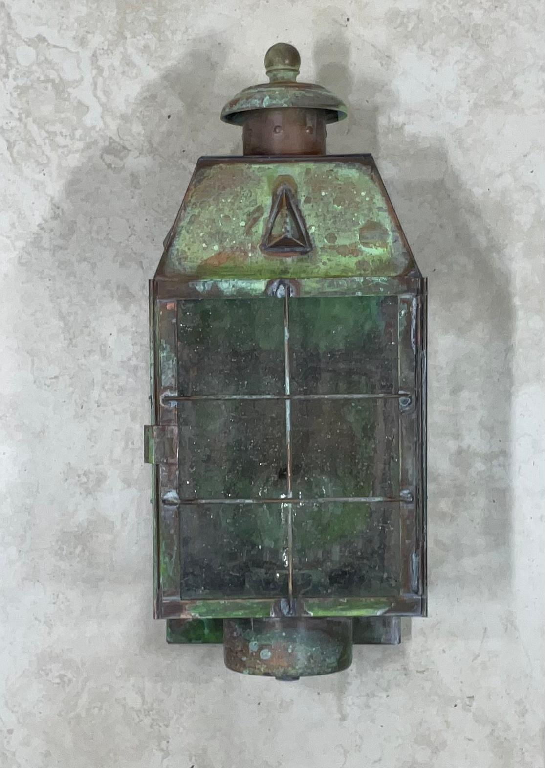 Single Wall lantern made of solid brass beautiful oxidized patina with one 75/watt light. Seeded glass , Suitable for wet location UL approved up to US code.