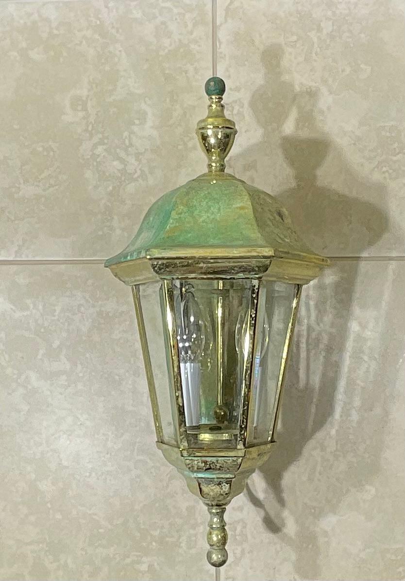 Single wall lantern made of solid brass, with two 40/watt lights bevel clear glass, UL approved up to US code, suitable for wet location.
Nice patina.
