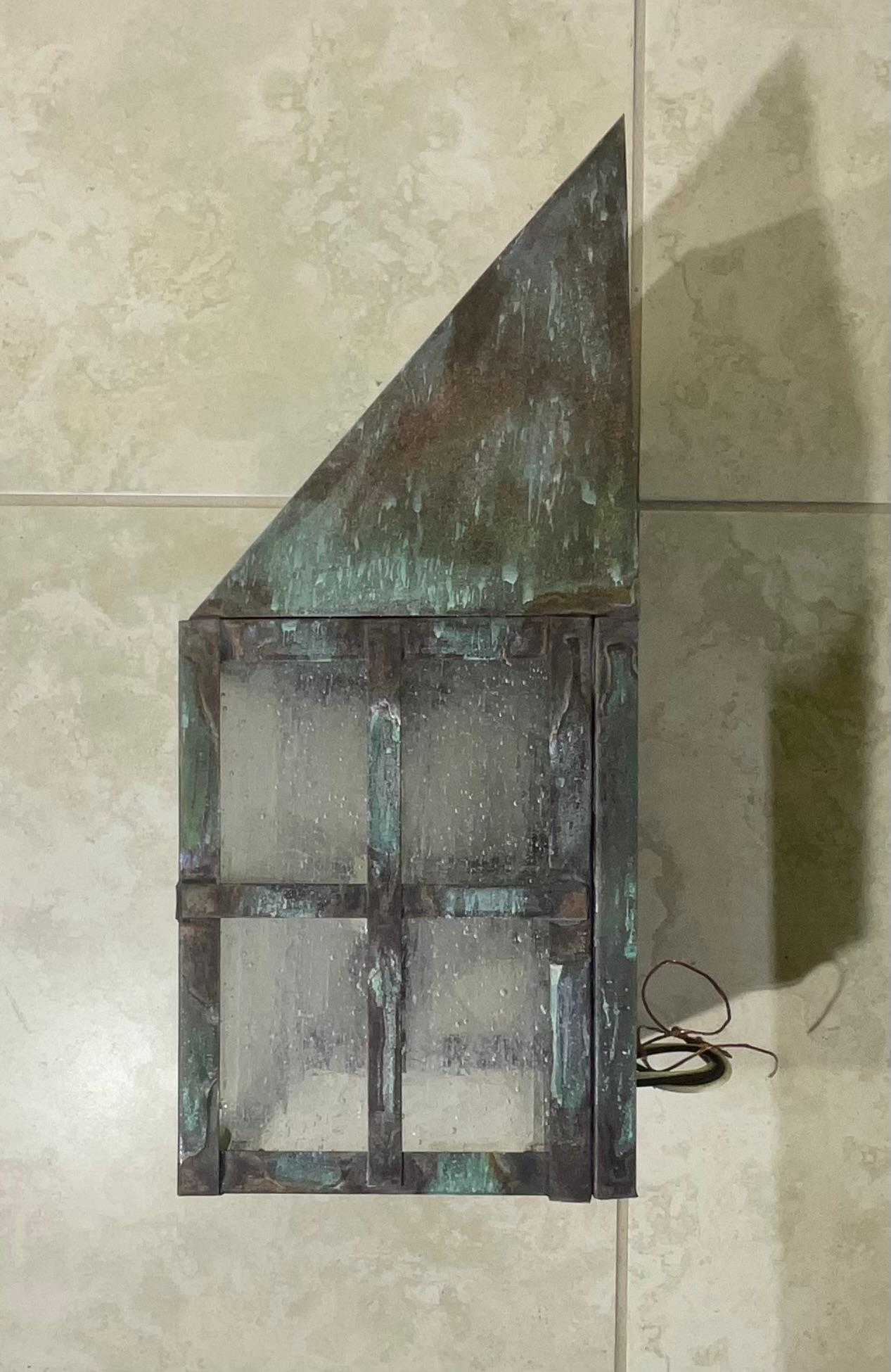 Single wall lantern made of solid brass, seeded glass , nice patina ,with one 60/watt light , suitable for wet location. Ready to use .

