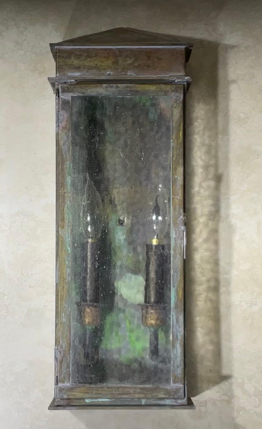 Quality Single hanging wall lantern made of solid brass with two 60/watt lights  , 
UL approved up to US code , suitable for wet location.
Beautiful patina .