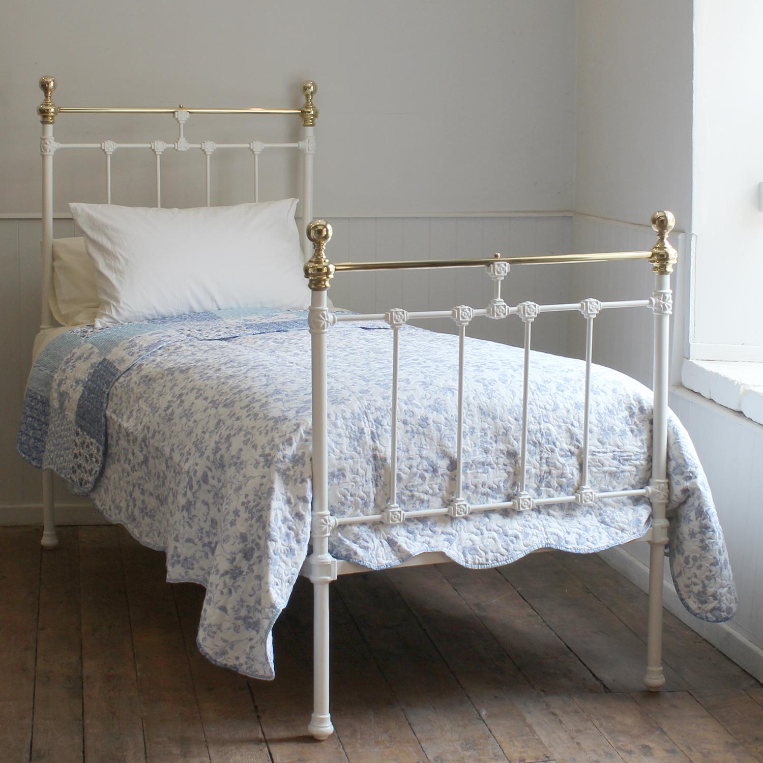 A traditional brass and iron antique bed painted in white with decorative castings on the head and foot board. 
This bed takes a standard single 3ft wide x 6ft 3in long base and mattress.
The price includes a firm base.
The mattress, bedding and bed