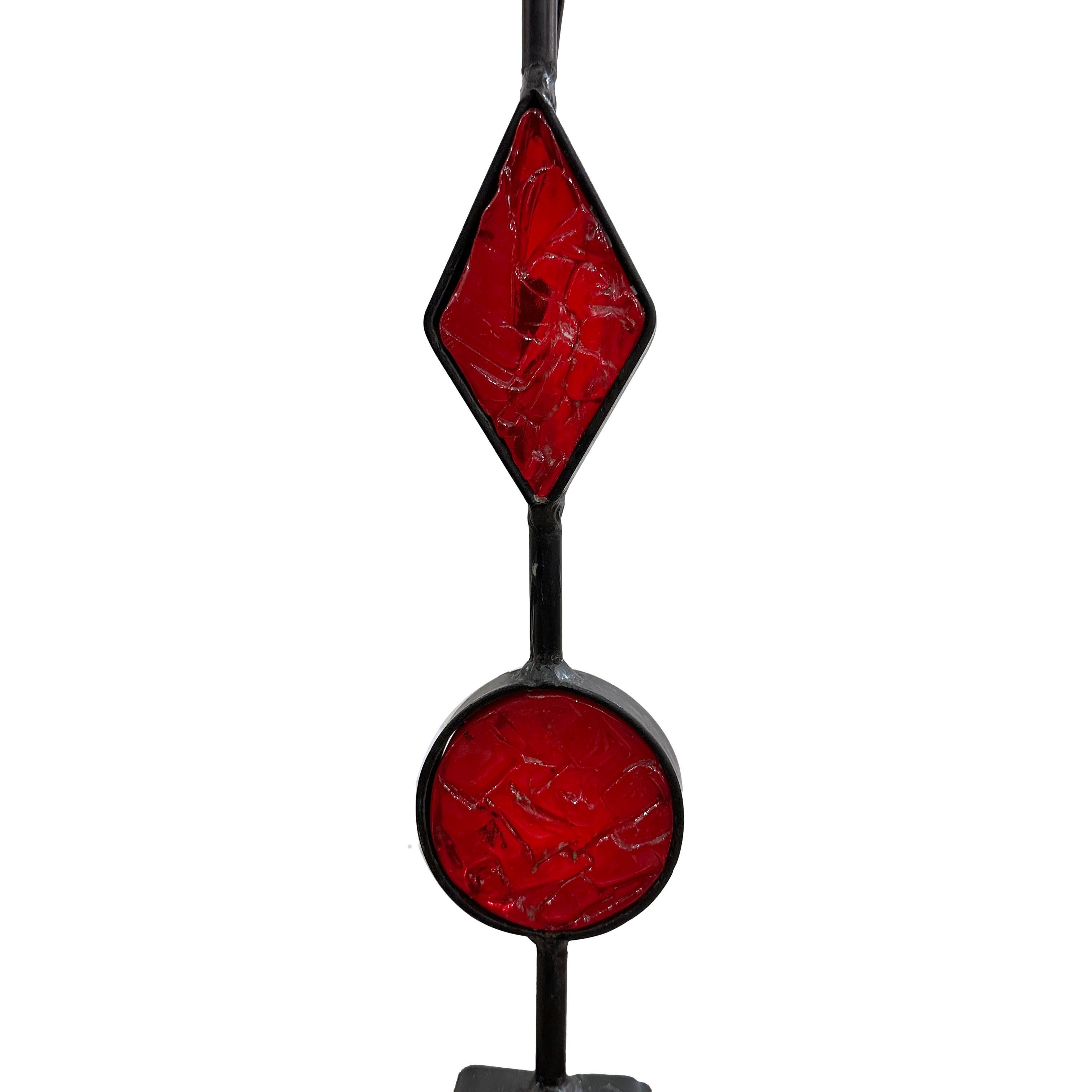 A single Danish circa 1950's iron lamp with red glass insets.

Measurements:
Total height: 49