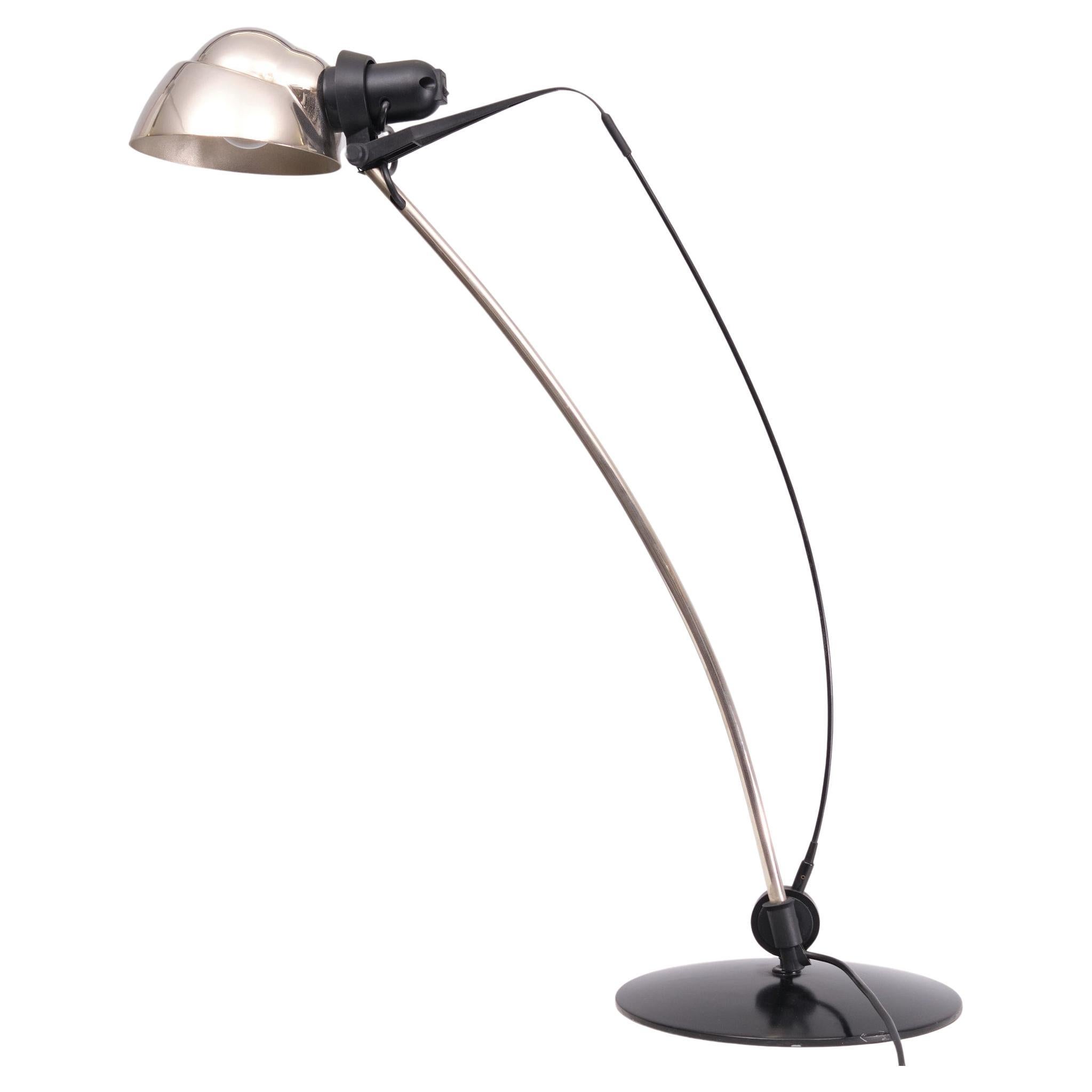 Very nice Table lamp . Design by Rene Kemna  for Sirrah 1980s 
Model Siní .  Good condition . Large E27 bulb needed.
 The tension of the form of this desk lamp is beautiful. The bow keeps the lamp in the right position. This lamp is in a very good