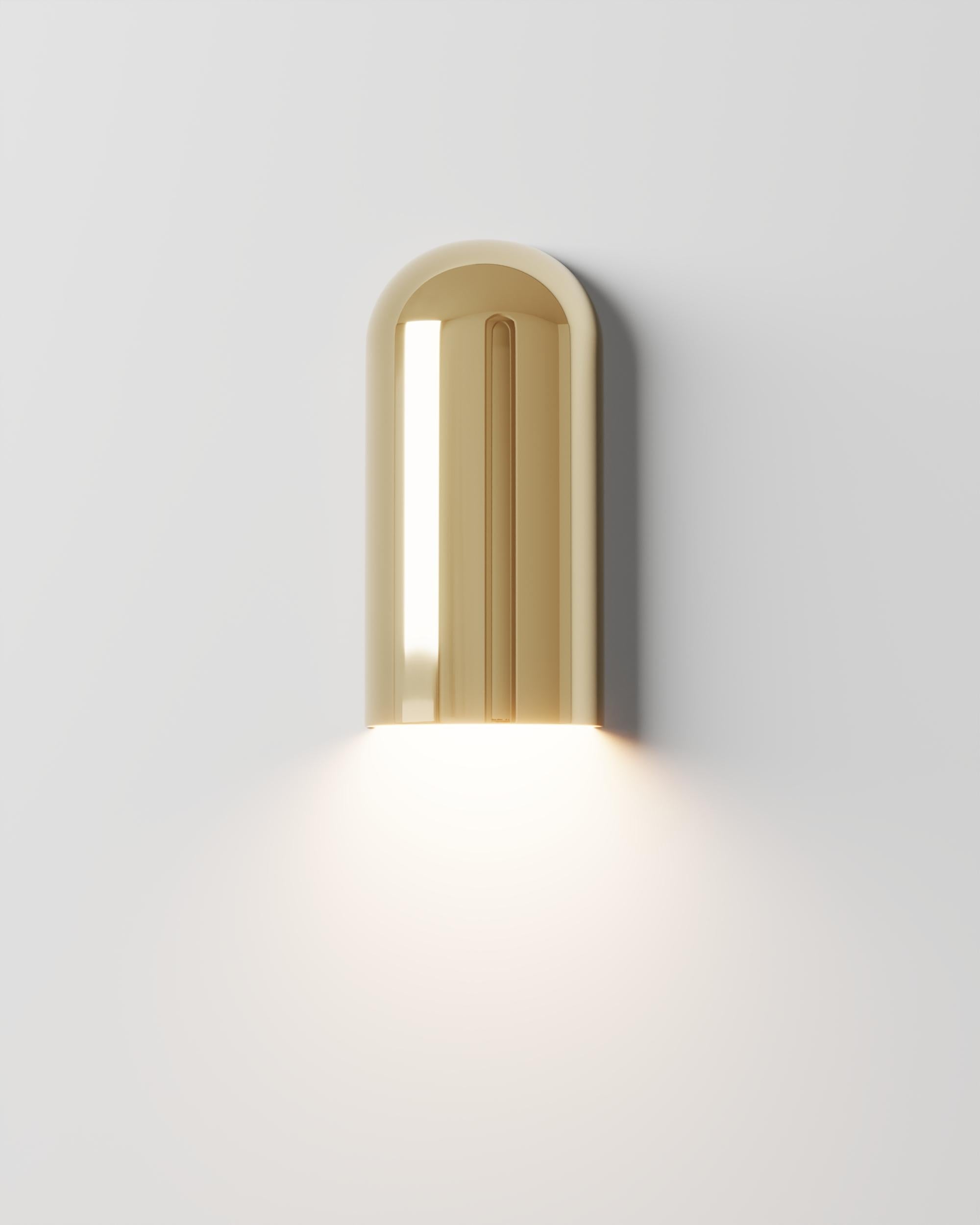 Sino Meio G Wall Lamp by Studio Orth
Dimensions: W 15 x D 10 x H 30 cm
Materials: Cast metal.
Finishes: Polished Cast Brass or Polished Cast Aluminum

Also available in Polished Cast Brass or Polished Cast Aluminum.

All our lamps can be wired