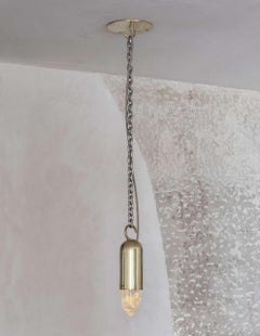 "Sino" Pendant in Cast Brass and Illuminated Raw Crystal by Estudio Orth