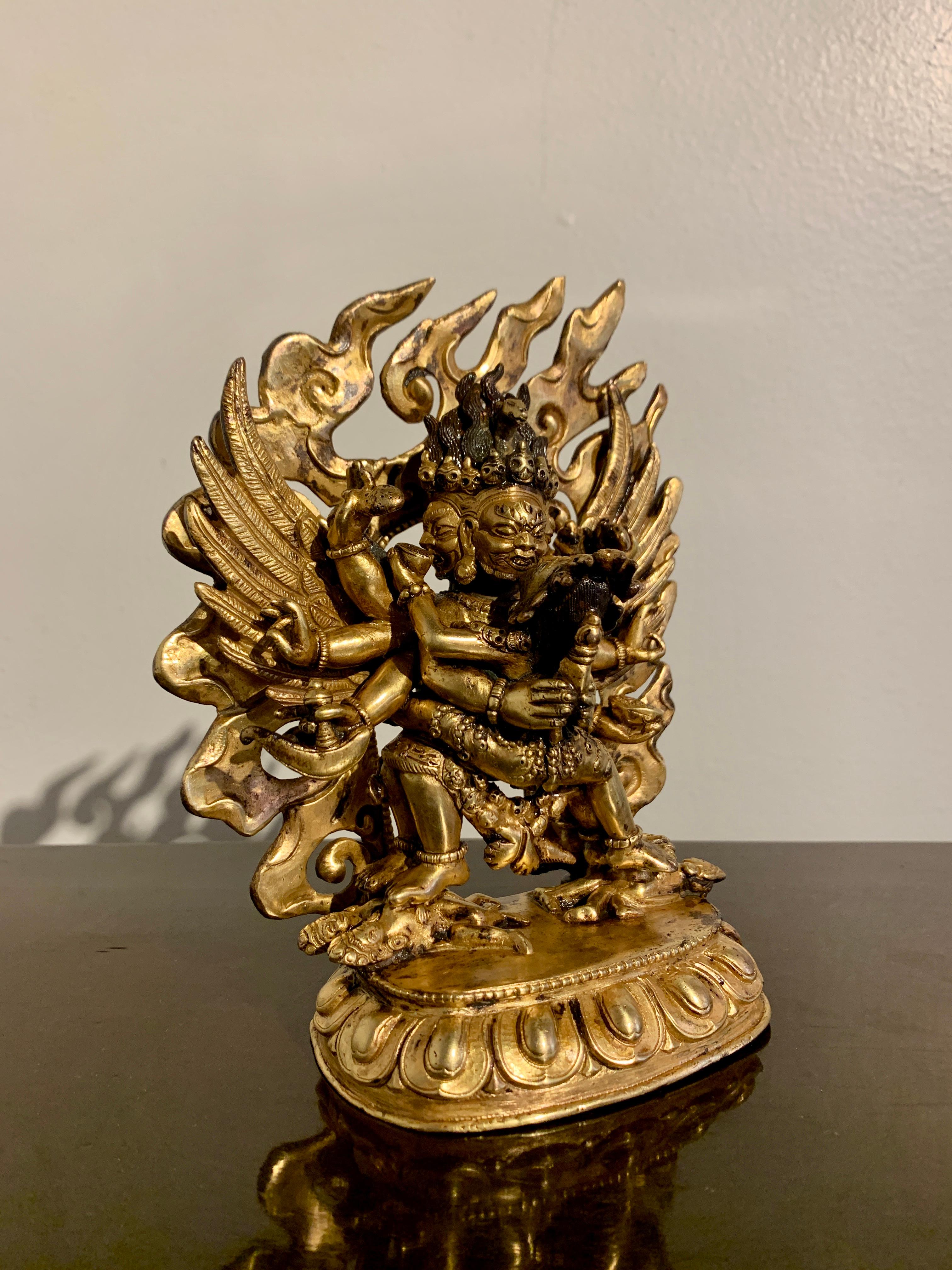 A fantastic and powerful Sino-Tibetan gilt bronze figure of Hayagriva and his consort Vajravarahi, created in Tibet for the Chinese market, 18th/19th century, Tibet.

The wrathful deity Hayagriva can be identified by the small horse head rising from
