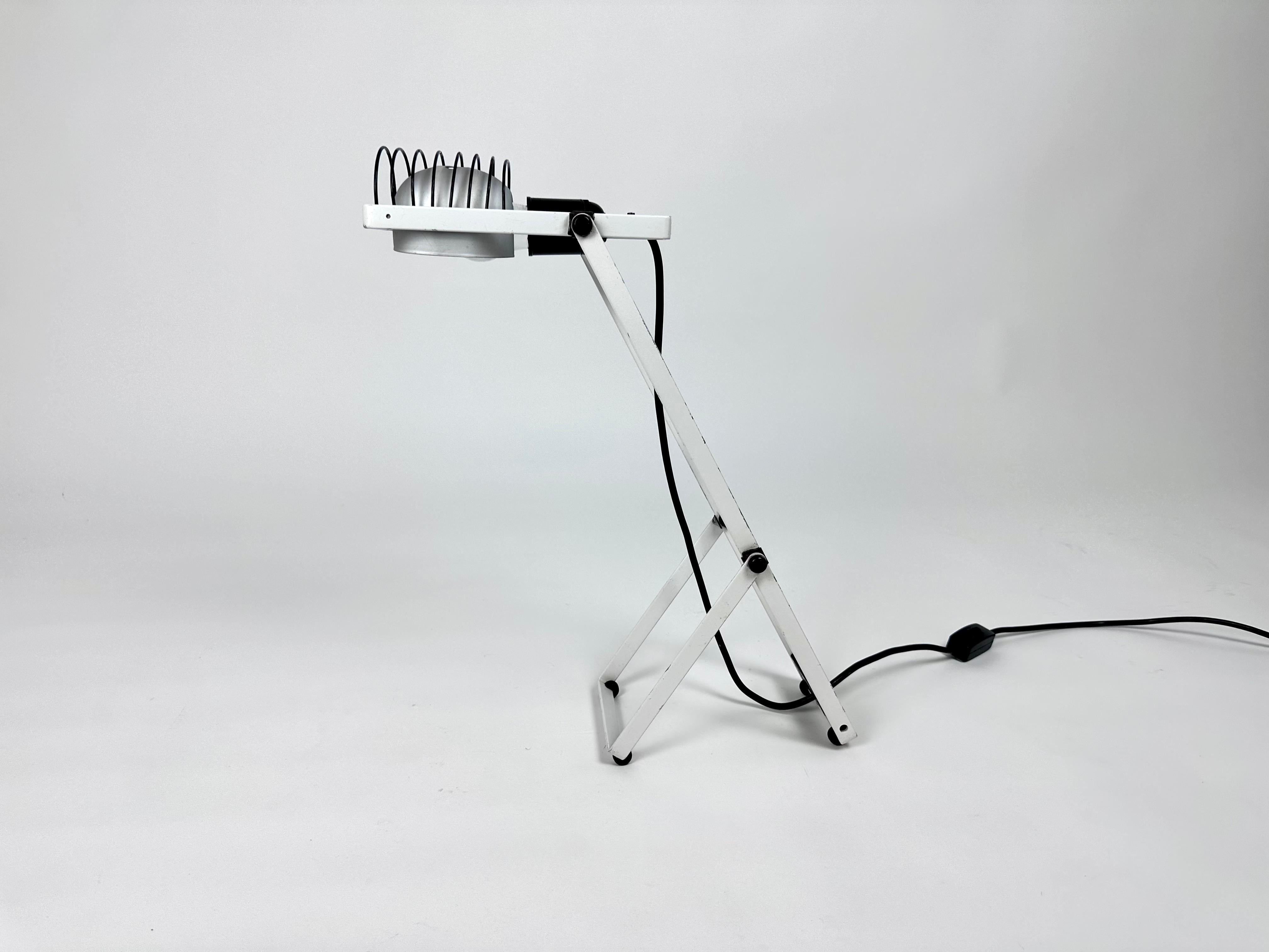 1970s desk lamp by Italian lighting manufacturer Artemide, designed by company founder Ernesto Gismondi.

As featured in the permanent collection of the Metropolitan Museum of Art, NY. This is the original design, first edition without the aluminium