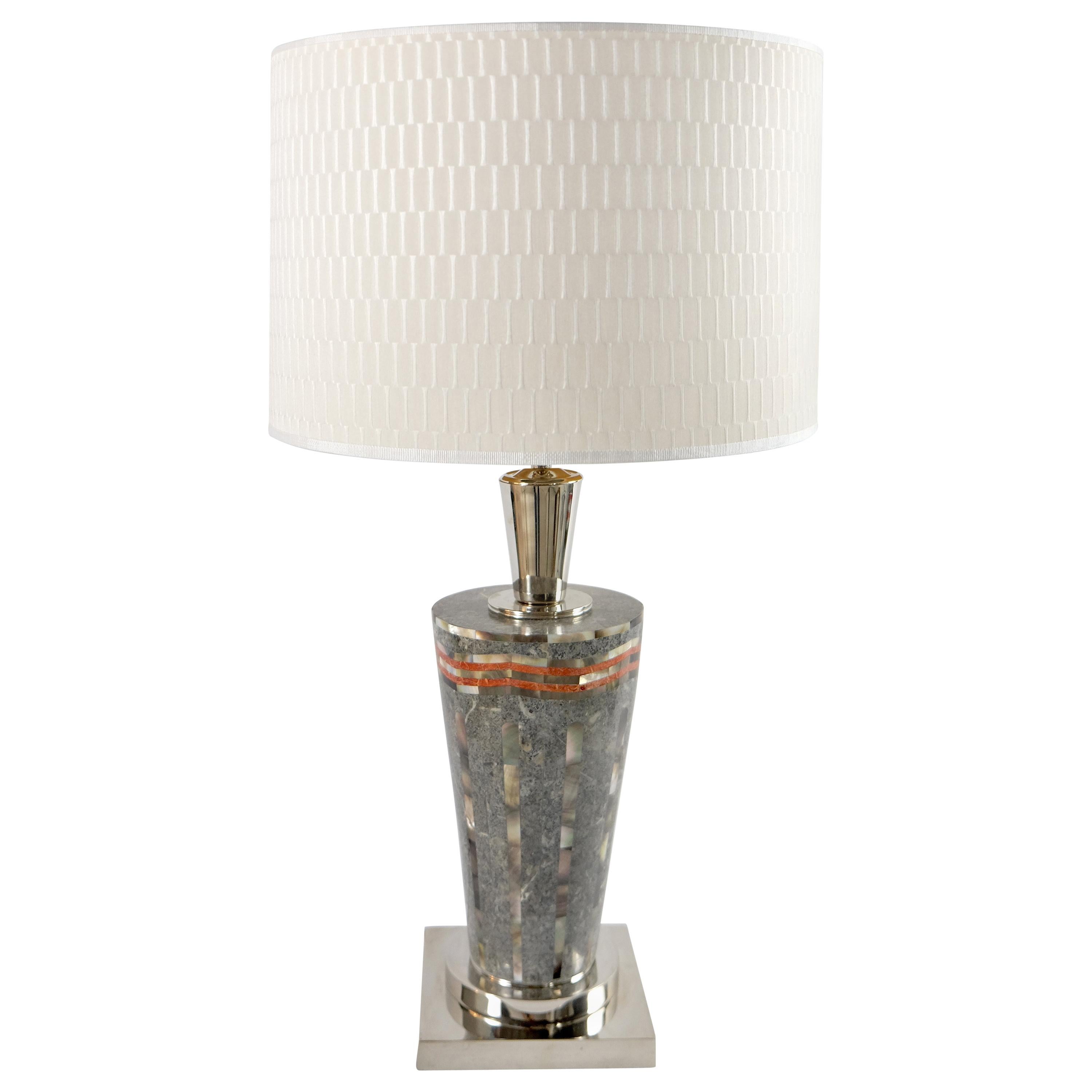 Laudarte Srl of Italy Table Lamp in Marble and Mother-Of Pearl 

Offered for sale is the Sintex Table Lamp with a sleek mosaic body of Mother-of-Pearl and stones from Ludarte Srl of Italy. The lamps are listed individually with a pair being