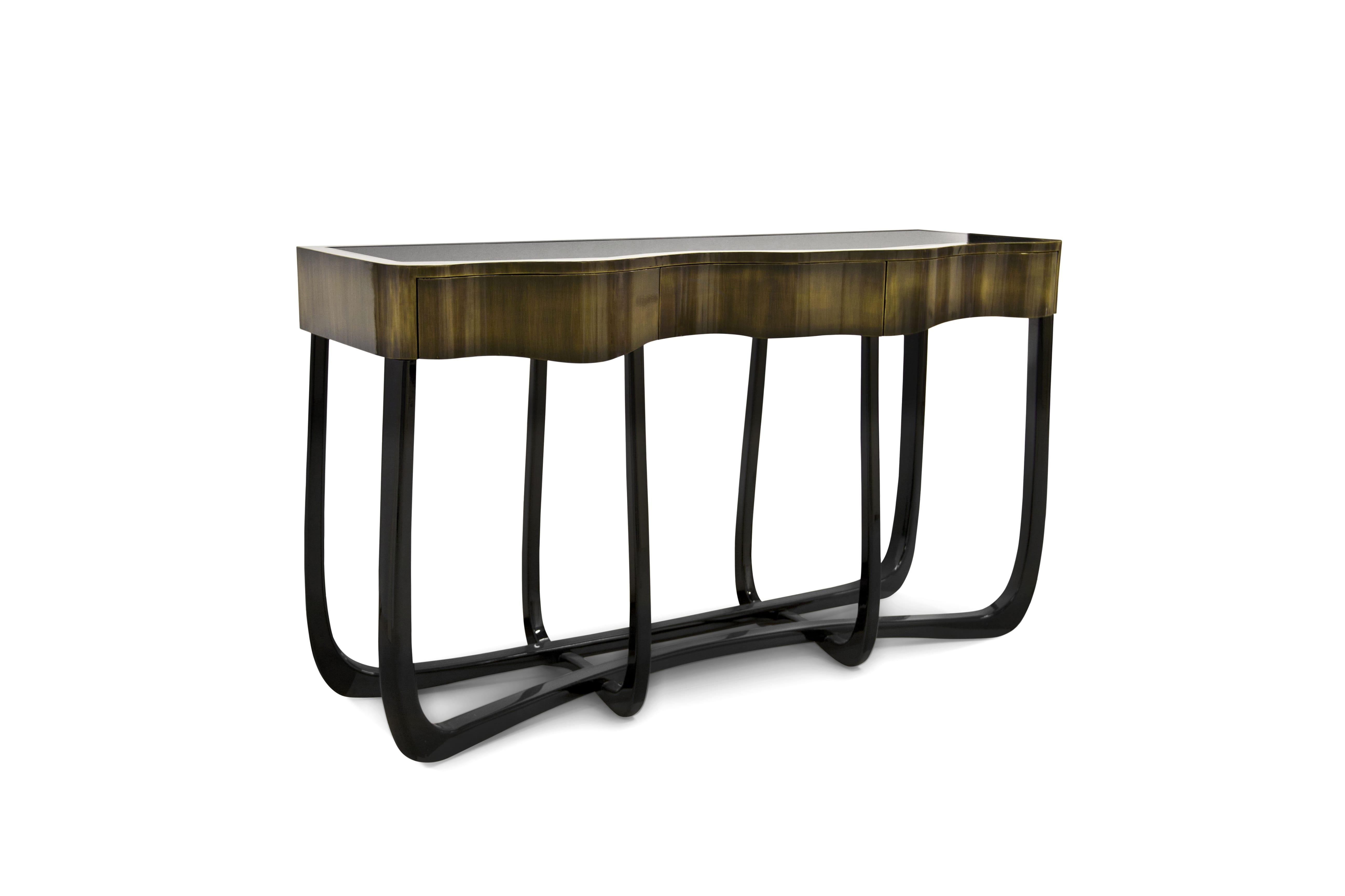 Boca do Lobo is an exclusive design furniture company that transcends the fusion of traditional and contemporary design. With the Sinuous Patina Console, you will successfully create a luxurious environment. Sinuous lines draw the elegant character