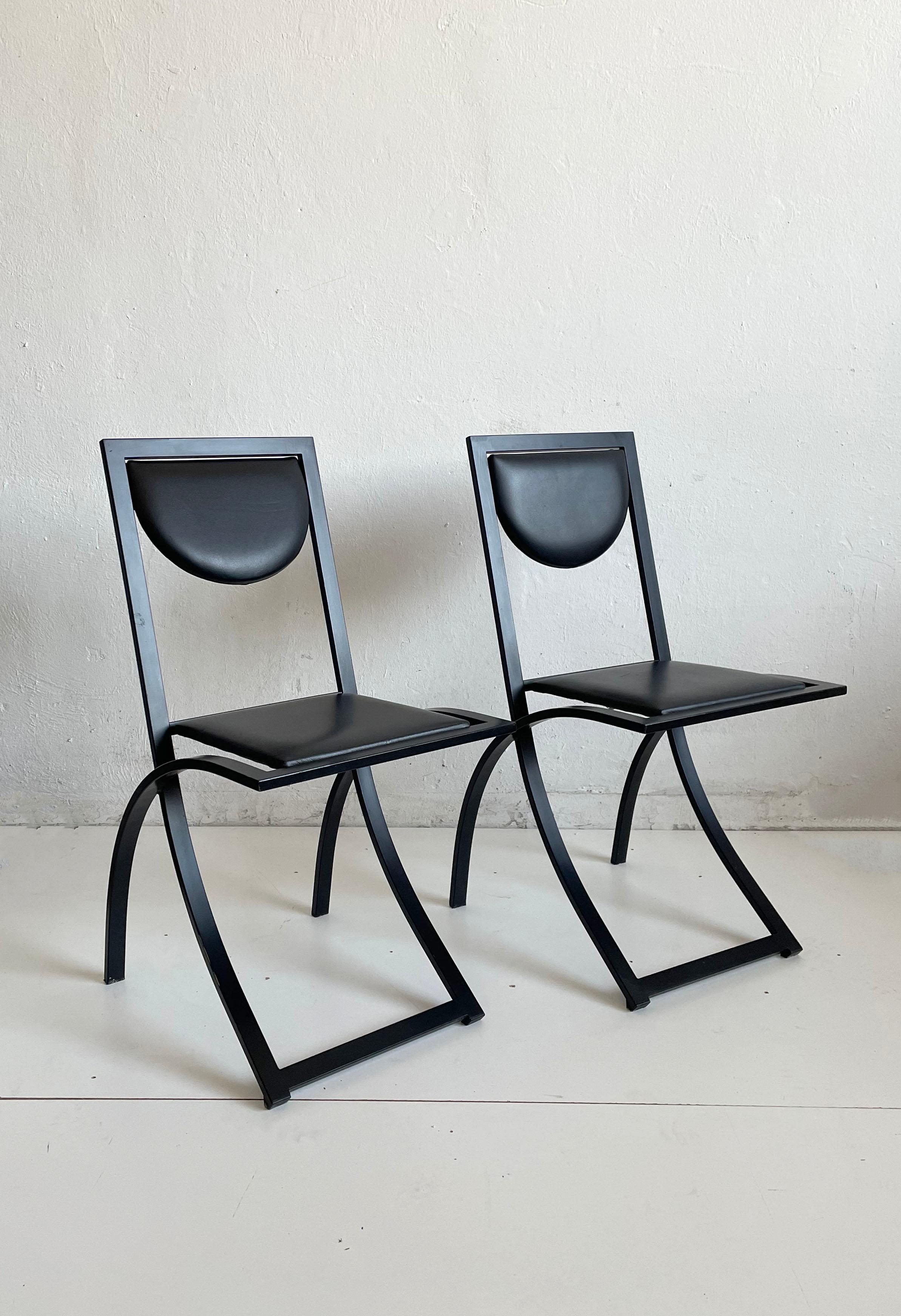 Set of 2 Postmodern dining chairs designed by Karl-Friedrich Förster, founder and owner of KFF

Age of production: ca 1990s

The chairs feature a very sturdy metal frame lacquered in matte black color and a seat and backrest upholstered in black