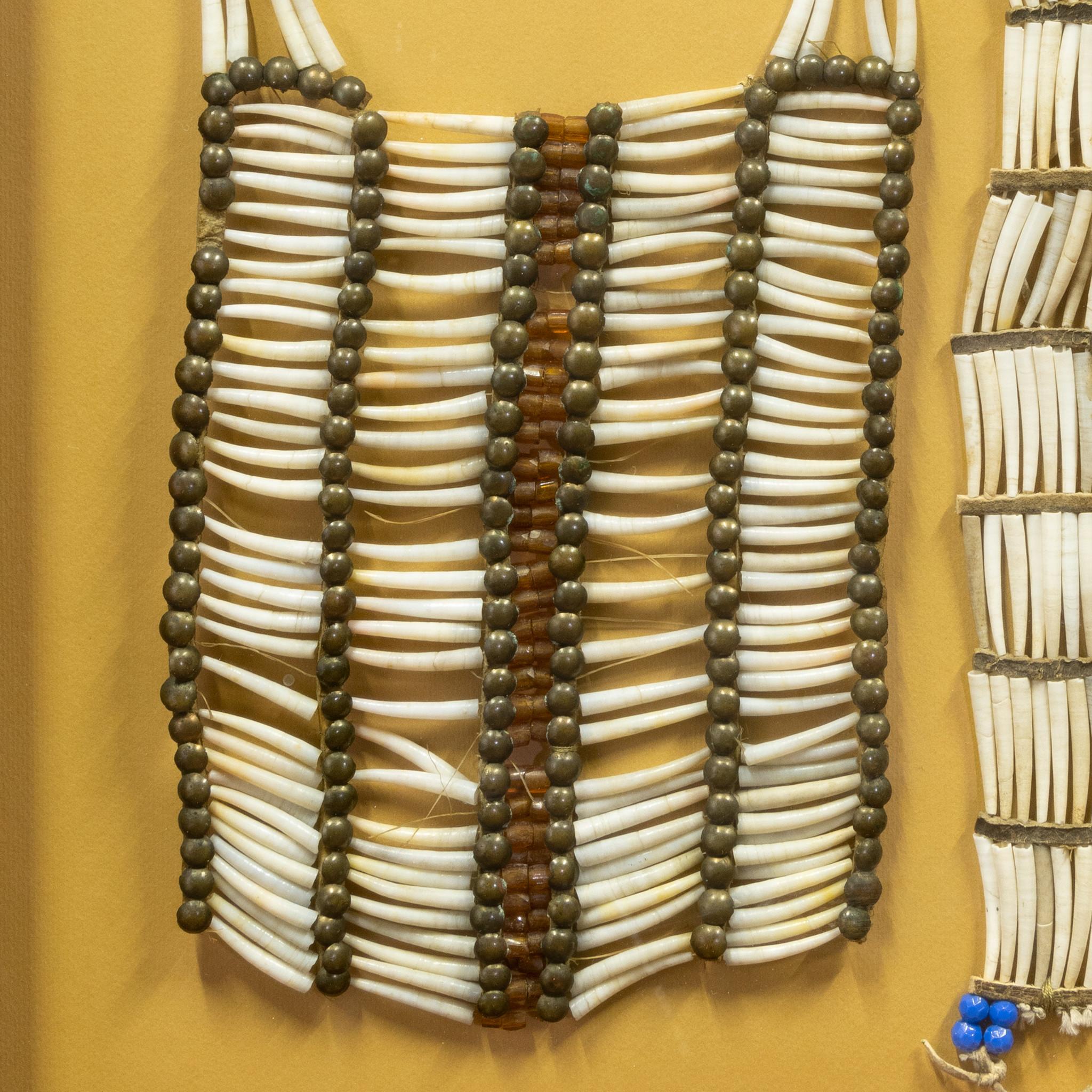 Sioux man's dentalia shell choker and boys breastplate with brass and glass beads in shadowbox. Choker 15