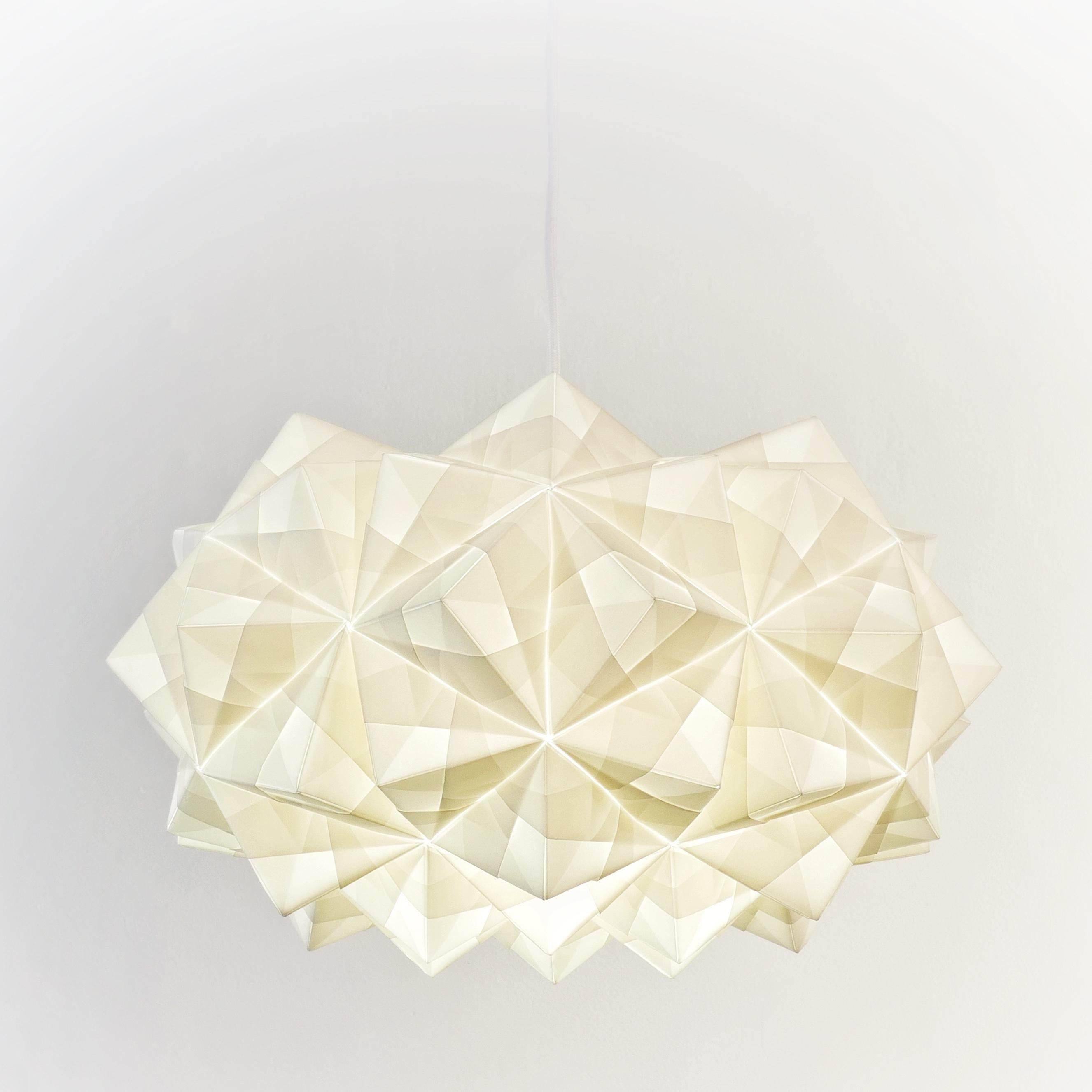 Elegant and at the same time soft and indirect light for a unique and personal home.  This Japanese style white paper pendant lighting called Siphonia is hand-folded from almost 70 sheets of paper. The Siphonia lamp is designed and artisanally