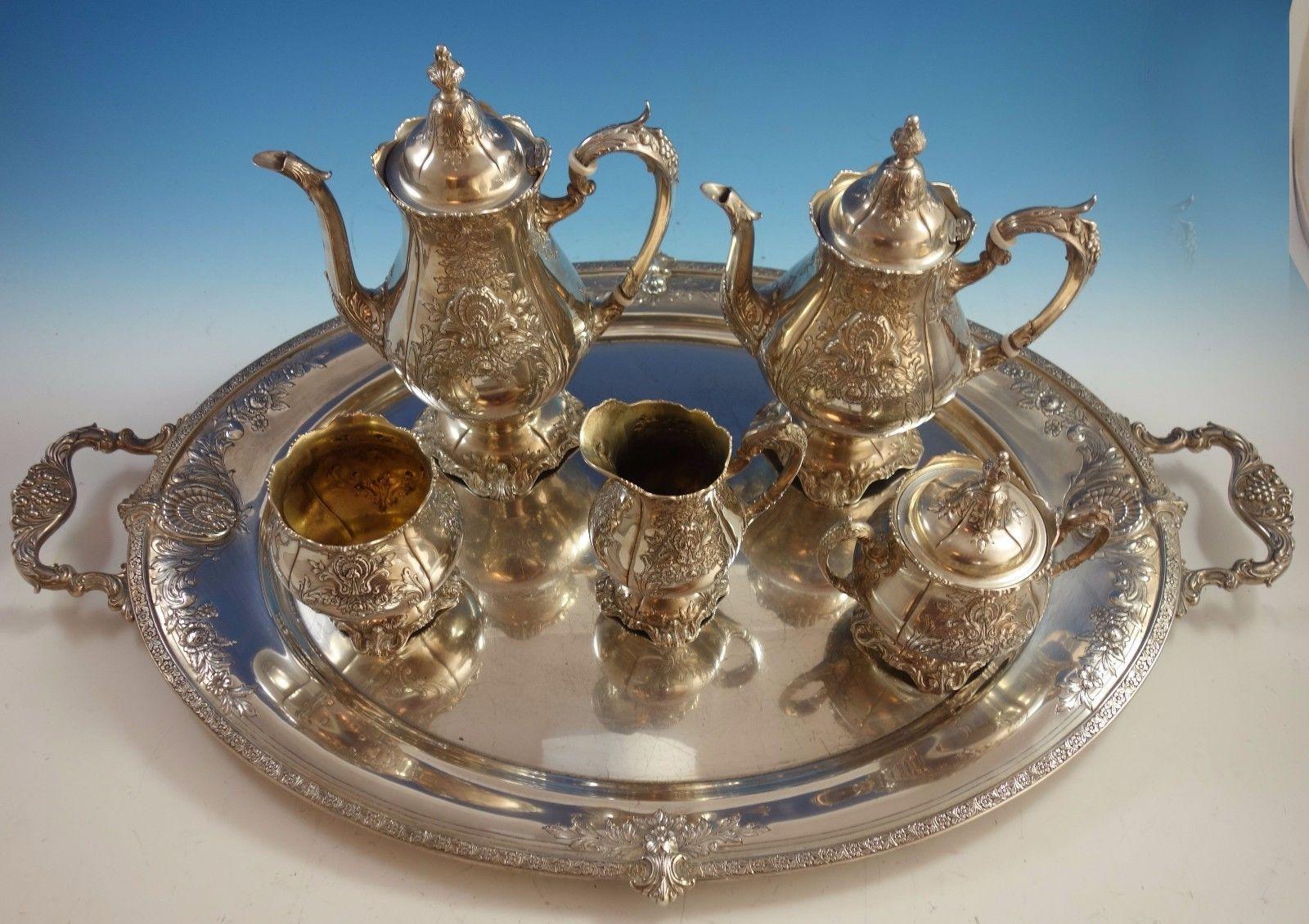 Sir Christopher by Wallace

Fabulous Sir Christopher by Wallace 5-piece sterling silver tea set with sterling silver tray. Hand chased and applied design. The pieces are not monogrammed and all the pieces are marked with #4800-1. The set