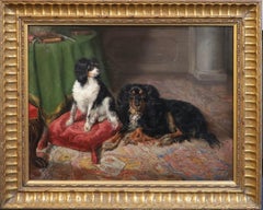 Antique English 19th century portrait of two spaniel dogs in an interior