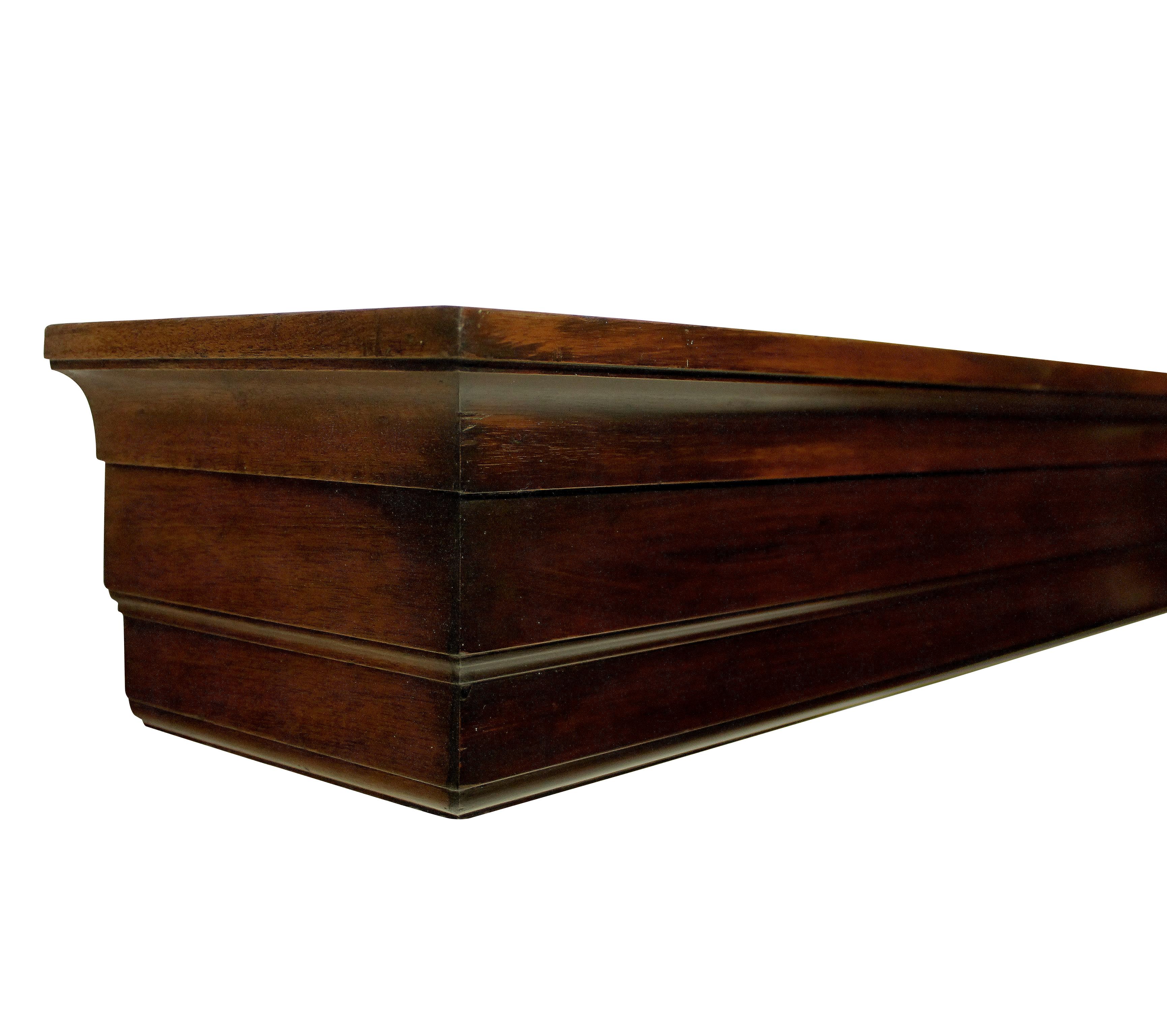A rare opportunity to own a piece of furniture designed by Sir Edwin Lutyens.
This pair of pelmets were designed by Lutyens for the billiard room of Papillon Hall in 1903. Of simple linear form, made from carved and lacquered mahogany. The house