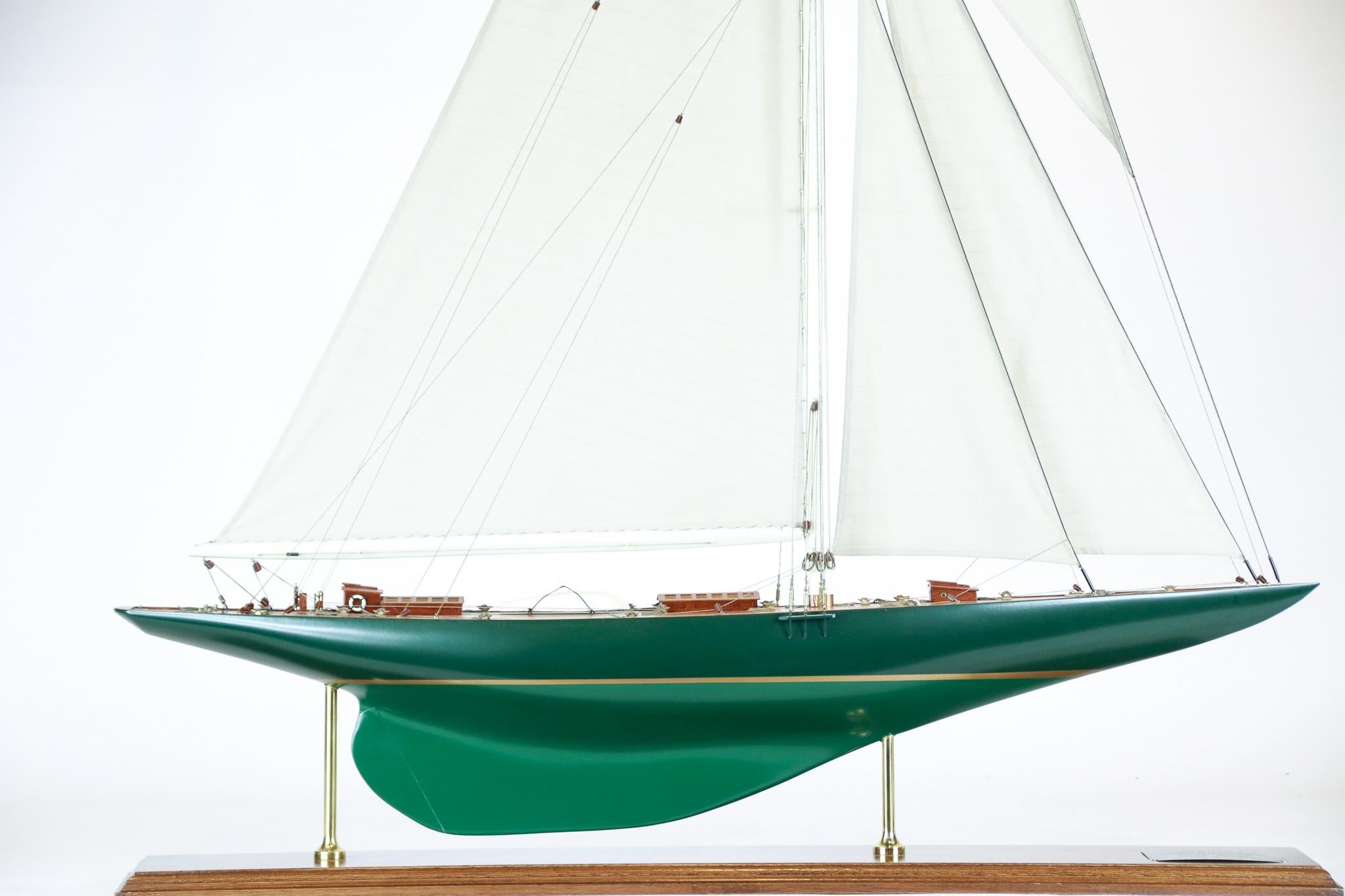 Model of Sir Thomas Lipton's America's Cup challenger Shamrock V of 1930. Shamrock sailed under the Royal Ulster Yacht Club against the New York Yacht Club's Enterprise. 

Shamrock V was built from wood, with mahogany planking over steel frames