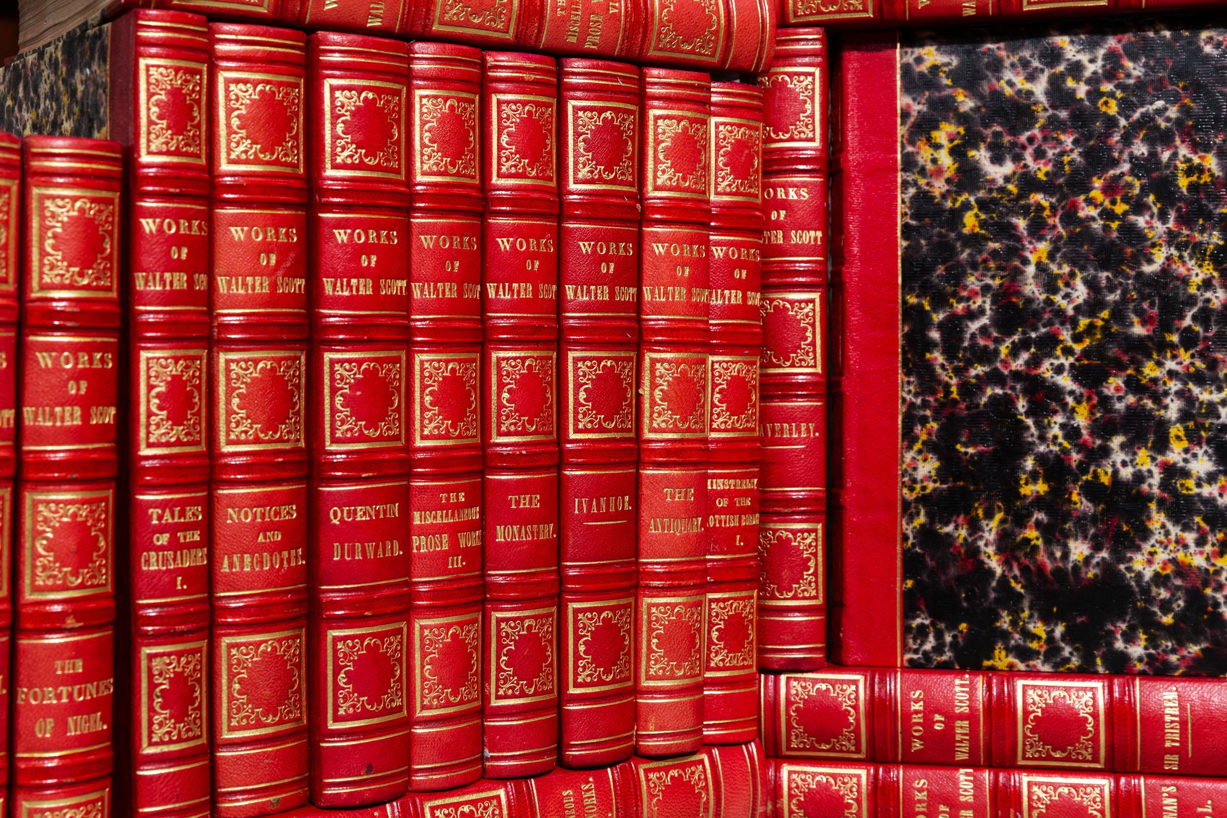 43 volumes. Sir Walter Scott. Waverley Novels. Bound in 3/4 Red Morocco, marbled Boards and Edges,
Raised bands, ornate gilt on spines. Published: Paris: Baudry 'S European Library 1838. Handsome set