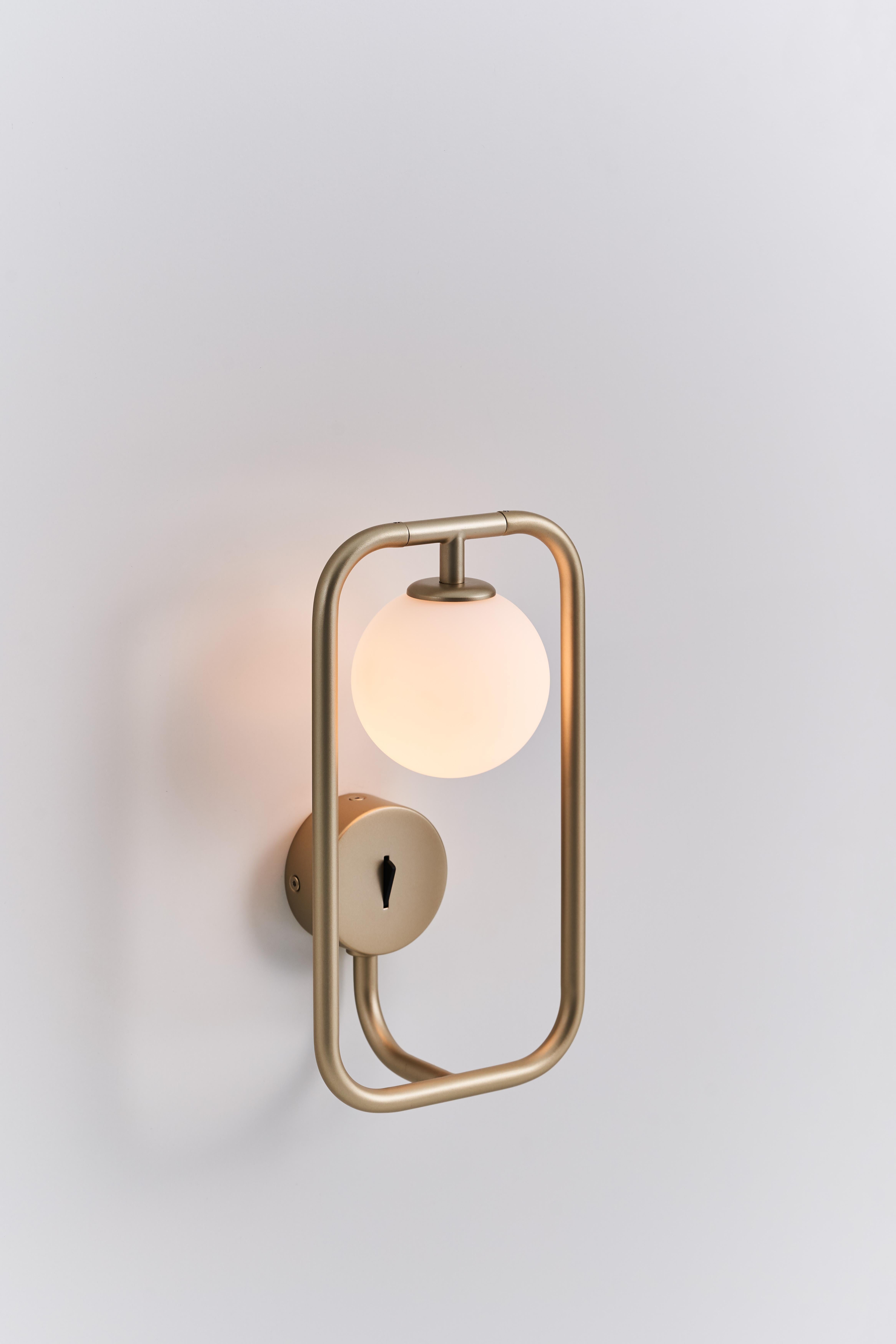SIRCLE wall sconce, a symbolization merged Square and Circle, inspired by the East aesthetic philosophy, the circular light ball just like a soft tender mind leans on the rigid prudent frame, chemically shaped a harmonious feature with its flexible