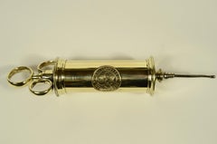 Brass syringe signed S. Maw Son & Sons London from the late 19th century