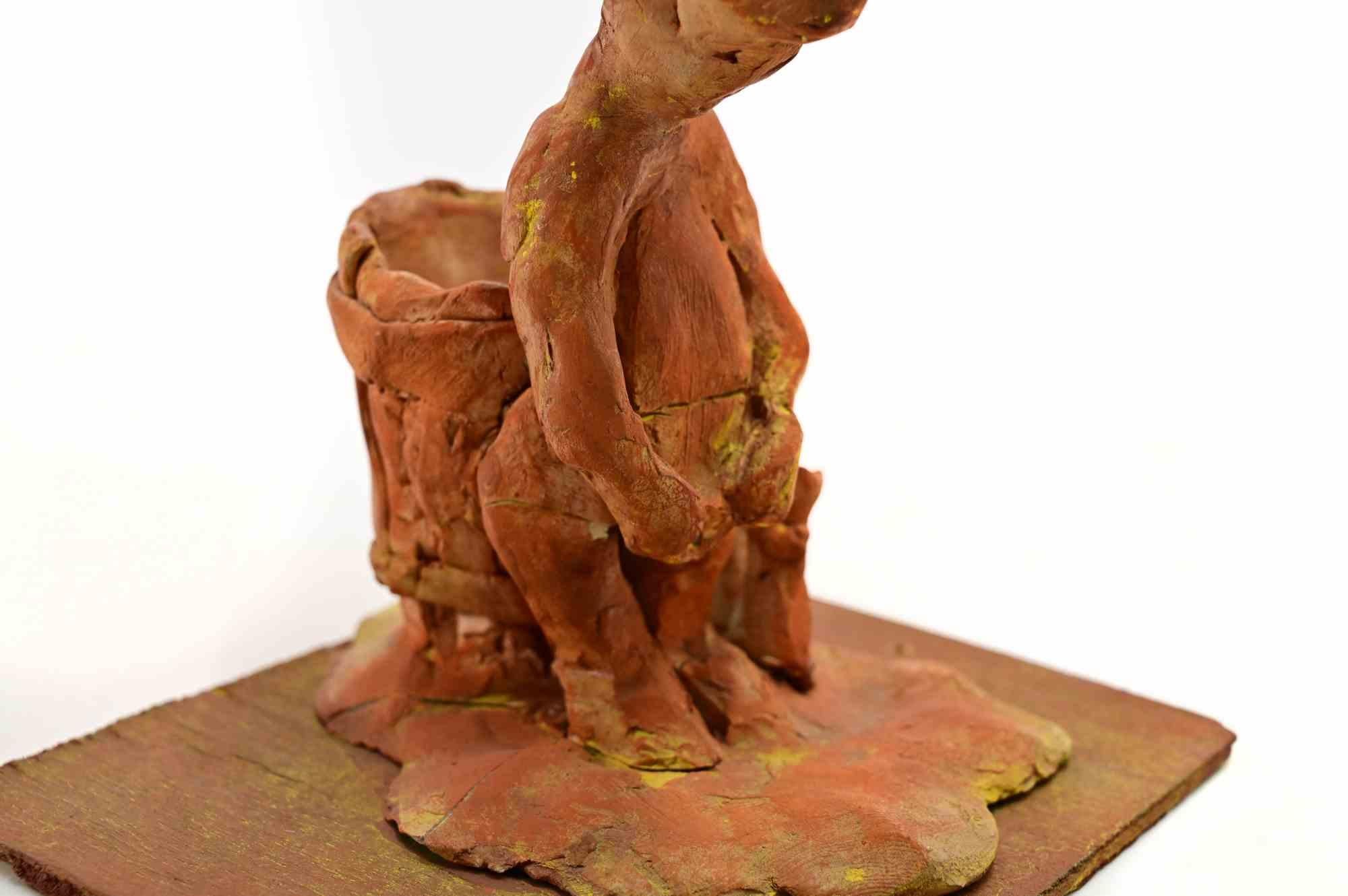 Femme au travail - Sculpture de Sirio Pellegrini - années 1960 en vente 1
