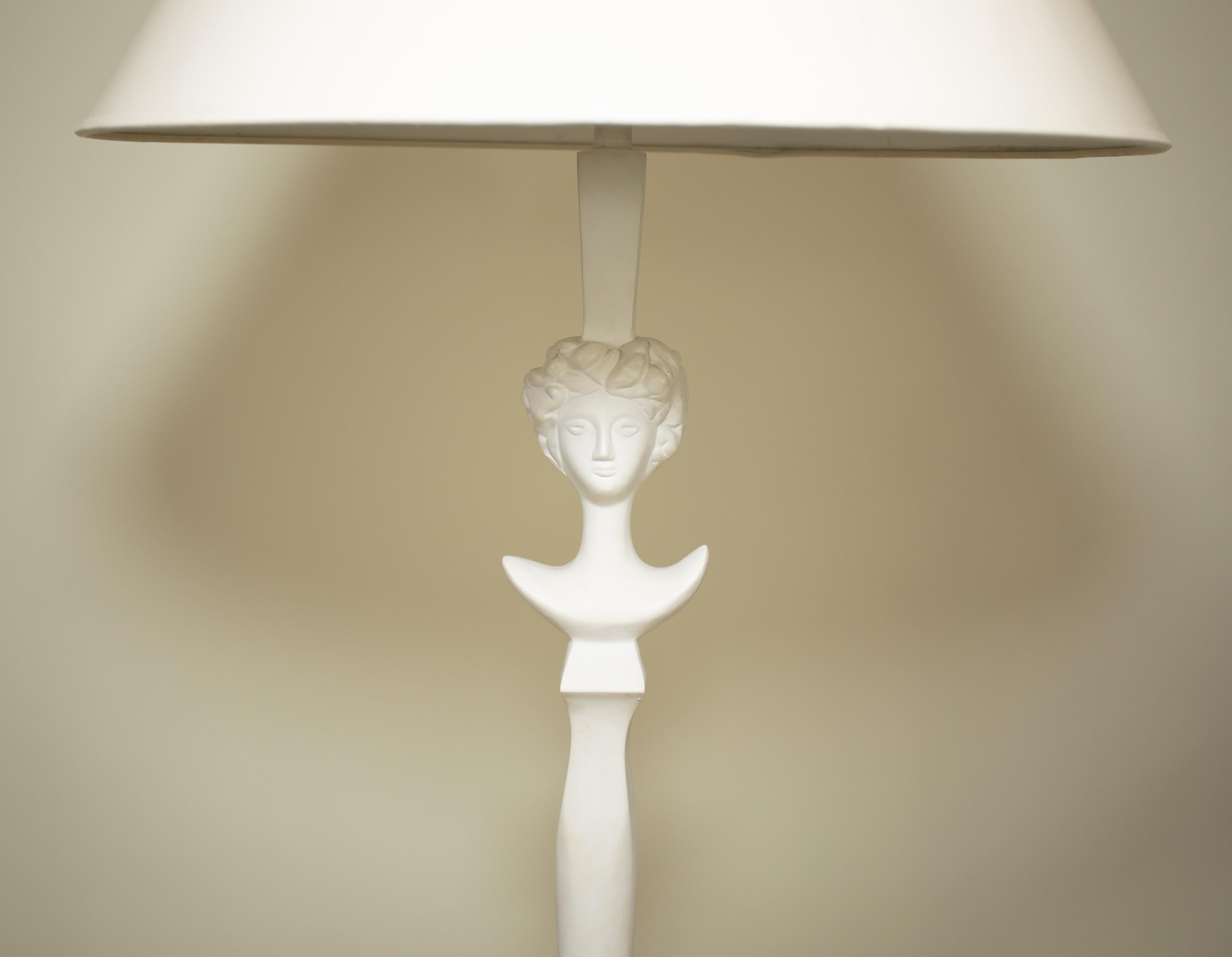 A Sirmos floor lamp after a design by Diego Giacometti
Original plaster surface and paper shade.