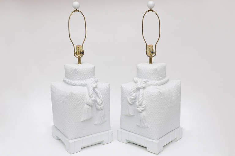 These monumental pair of Sirmos plaster of Paris white square lamps with original round plaster finial balls are textural, dimensional and make a great presence. They have been fully restored. They are heavy in weight and stature. Their texture is a