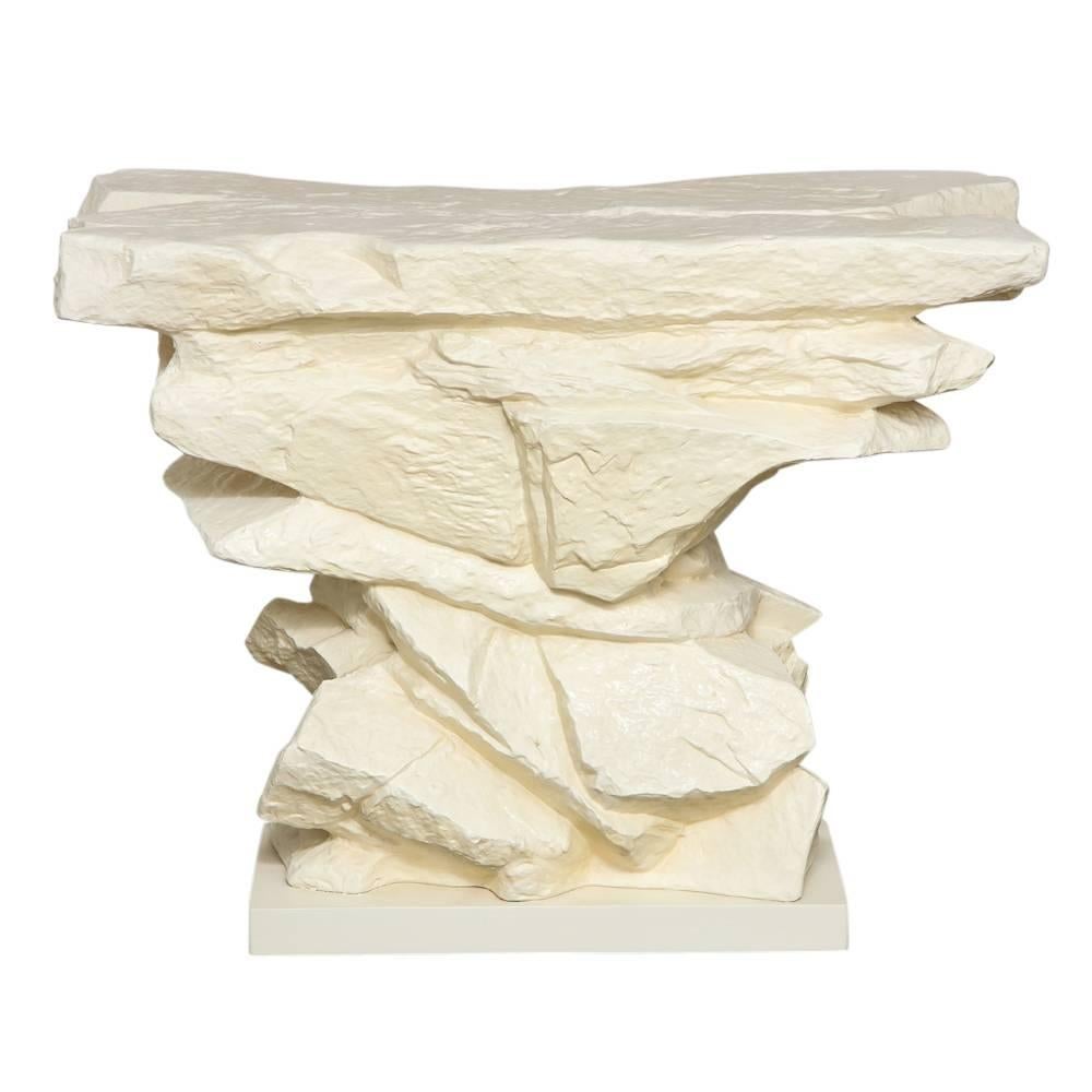 Sirmos Console Table, Quarry Rock, Plaster and Glass. Off-white, in color, stacked rock form sculptural console table by Sirmos in very good condition. Purchased directly from the original owner. The console base without the glass measures: 31