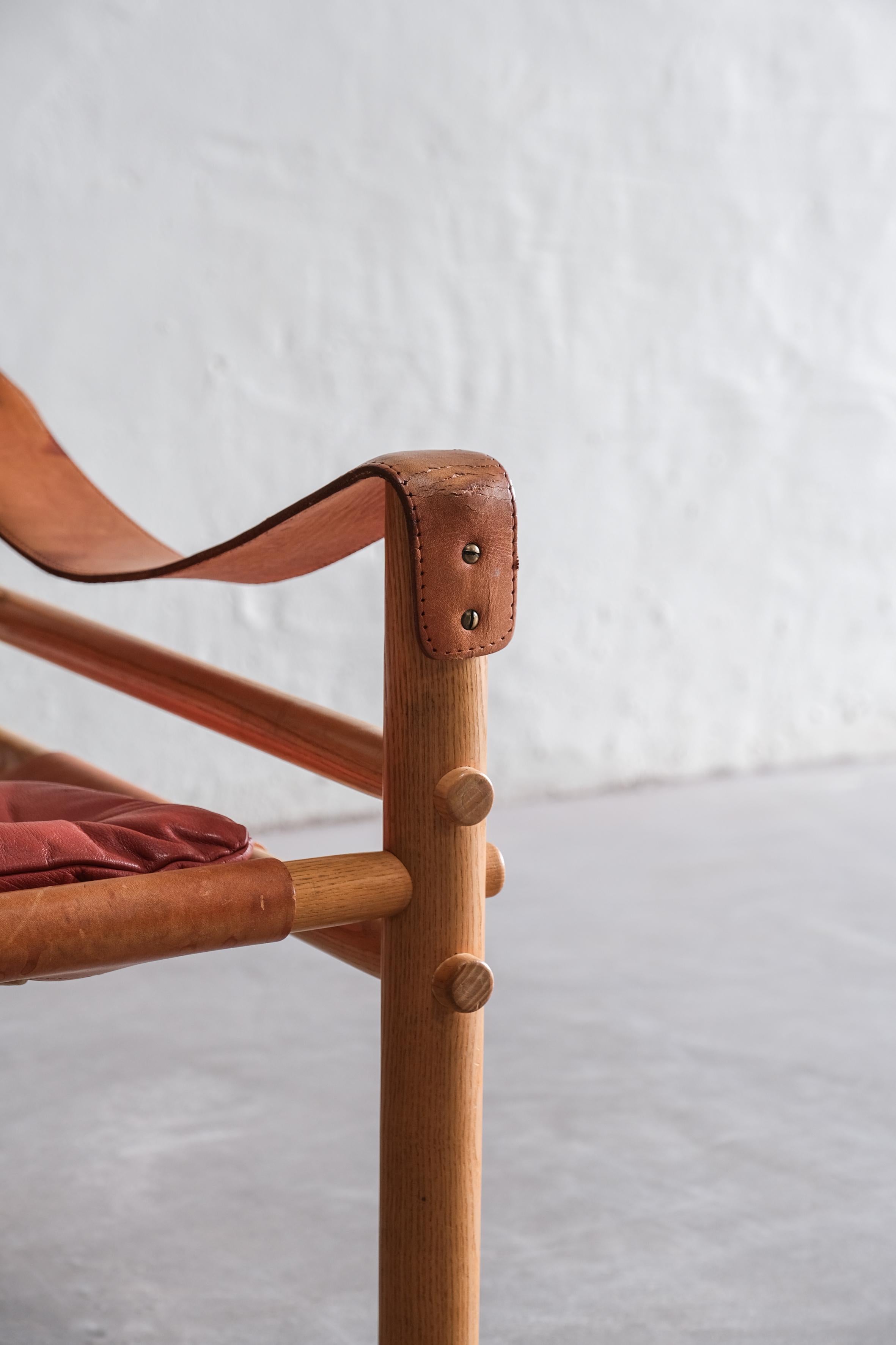Sirocco Safari chair by Arne Norell in red leather, Sweden 1970 1