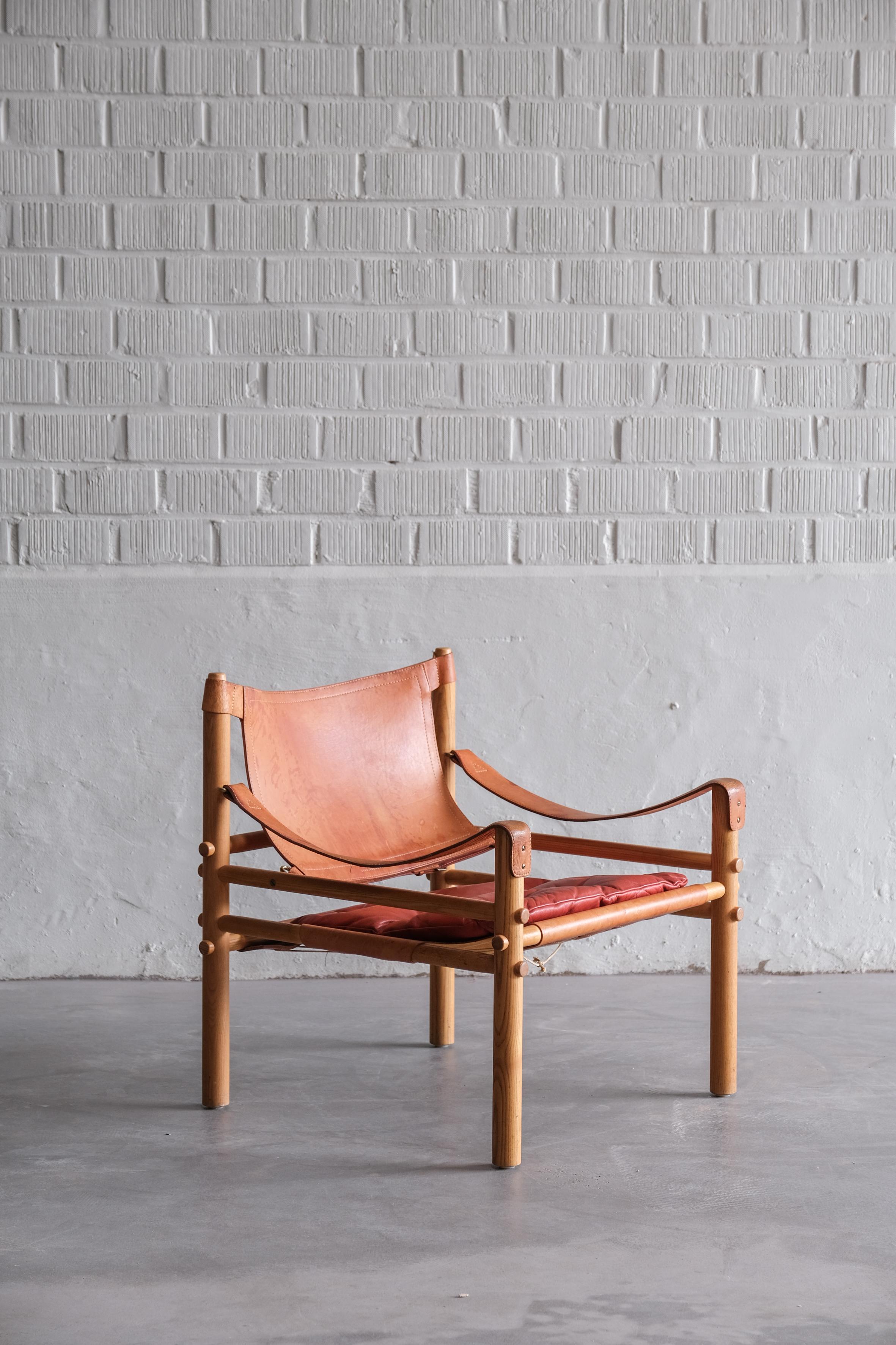 Original Safari chair designed by Arne Norell made out of wood and leather.
beautiful patina on the leather. 