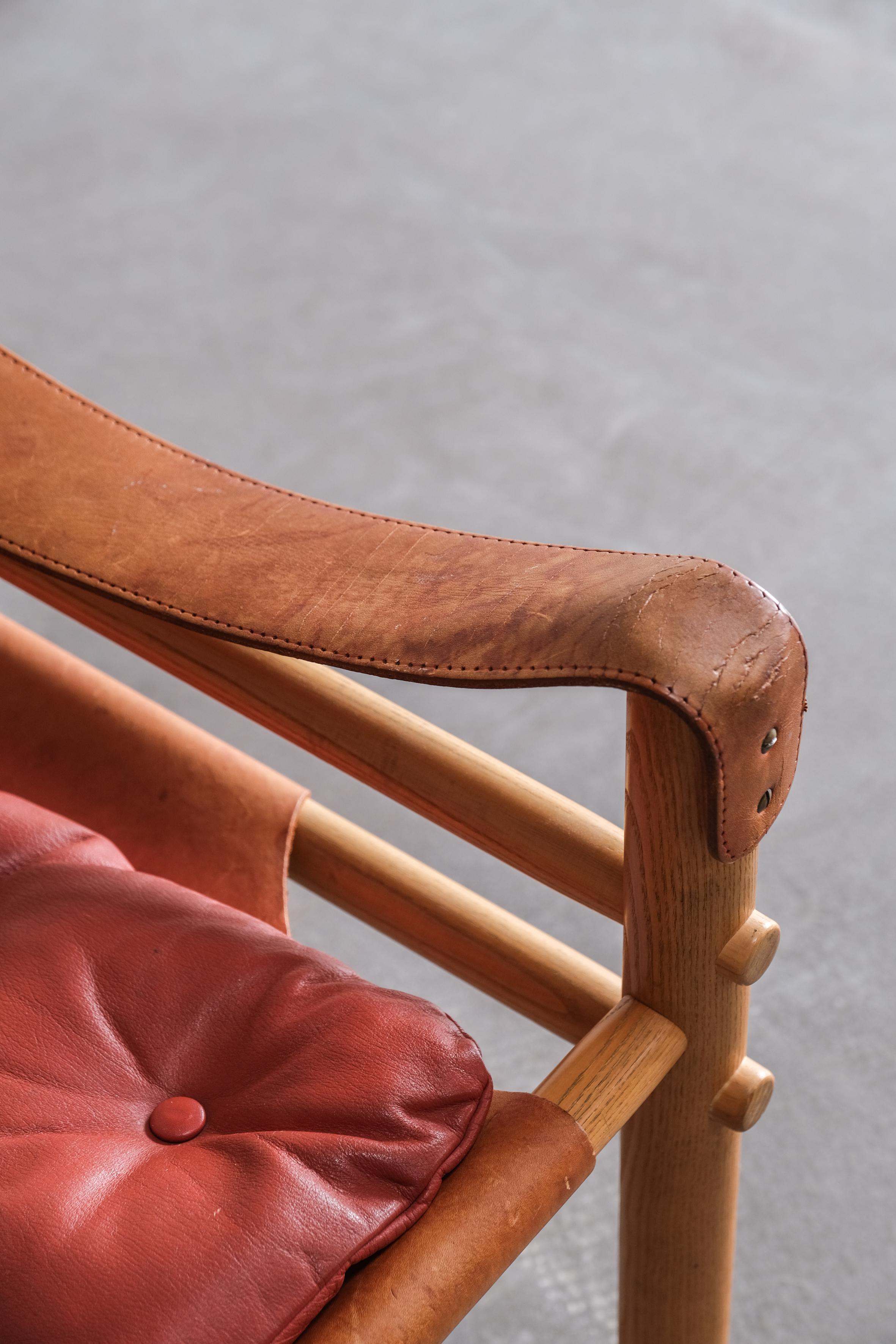 Leather Sirocco Safari chair by Arne Norell in red leather, Sweden 1970