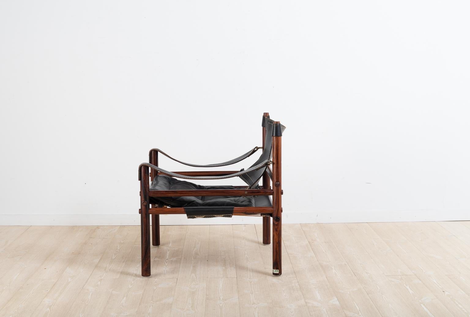 Scandinavian Modern Sirocco Safari Chair in Black Leather by Arne Norell 