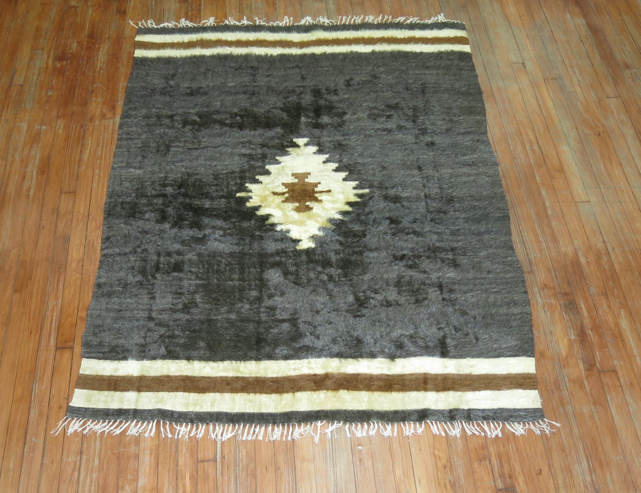 A mid-20th century one of a kind Turkish sirt rug woven with Mohair wool. These pieces are inspired by traditional tribal weaving's but they are used mostly for decorative purposes and have a strong modernist appeal. The unique pile technique adds a