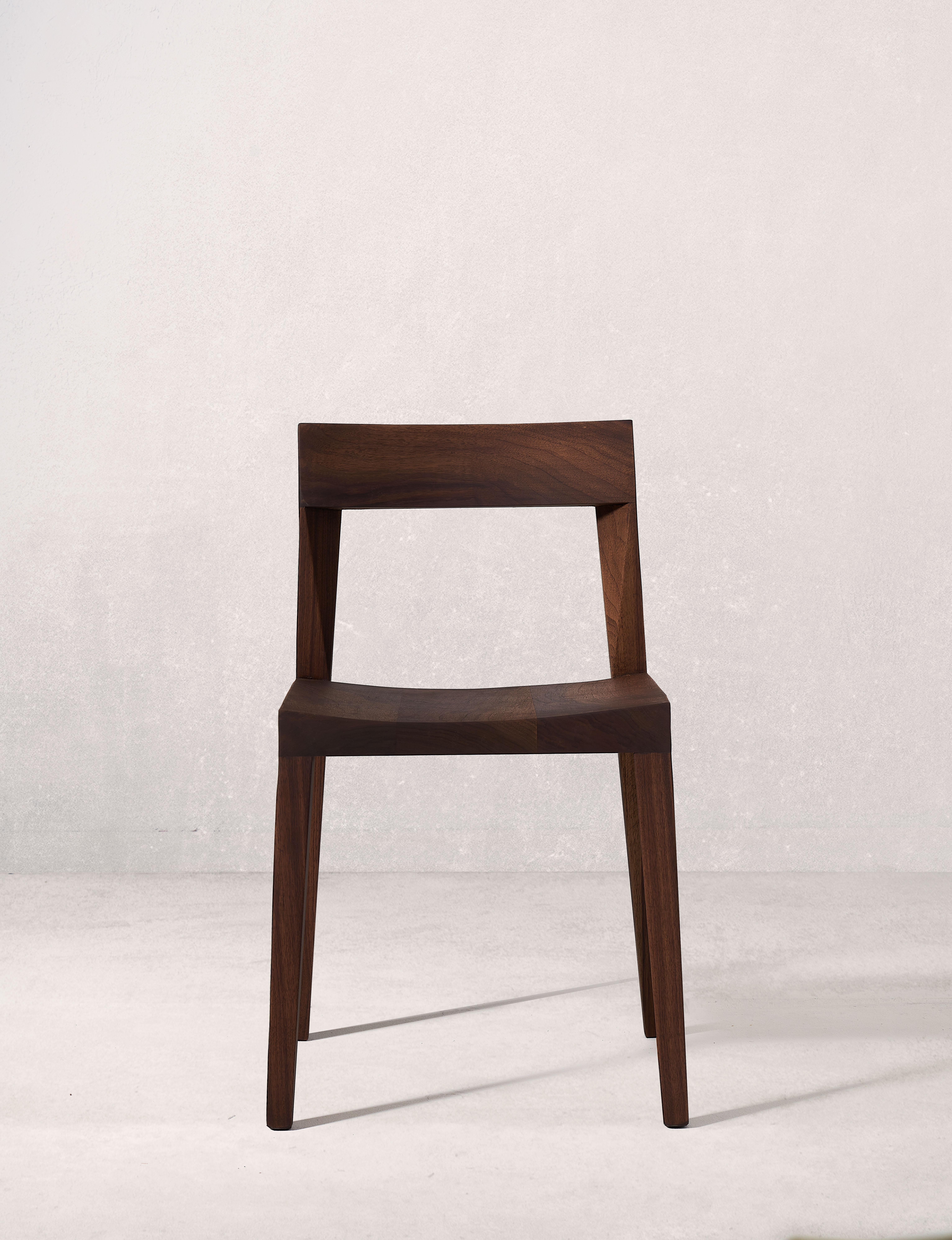 Sirwa Chair by Selma Lazrak
Dimensions: D 50 x W 46 x H 77 cm 
Materials: Solid American walnut.

The chair mirrors the contours of the Sirwa region in Morocco, known for its dramatic peaks and valleys.
The smooth and unbroken lines are refined to