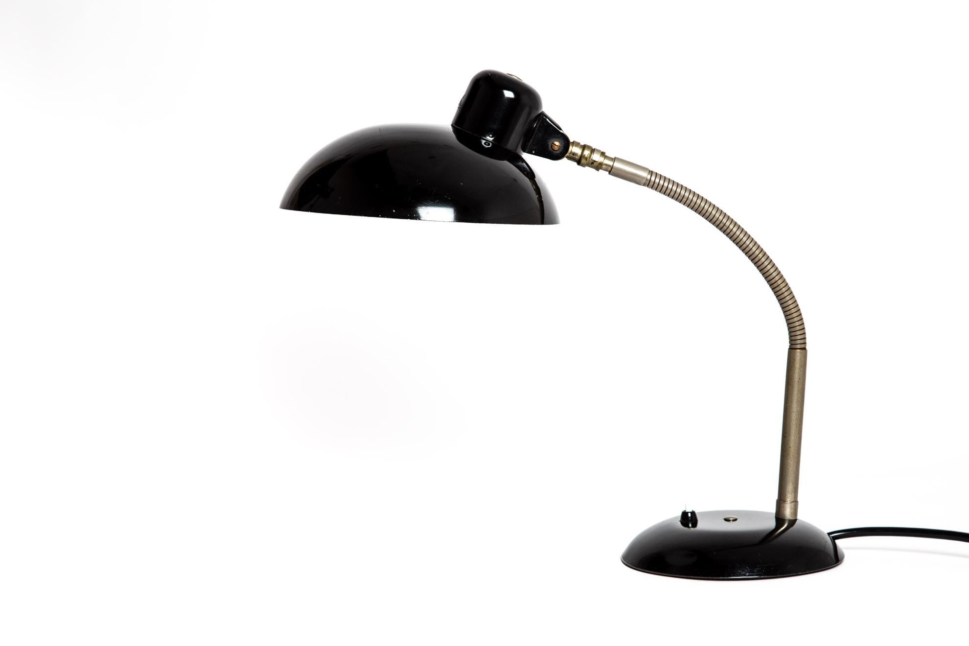 SIS table lamp black metal. Robust and flexible desk lamp from Germany. The lamp has a flexible Stand and can move in more directions. Switch on the base. Marked with 