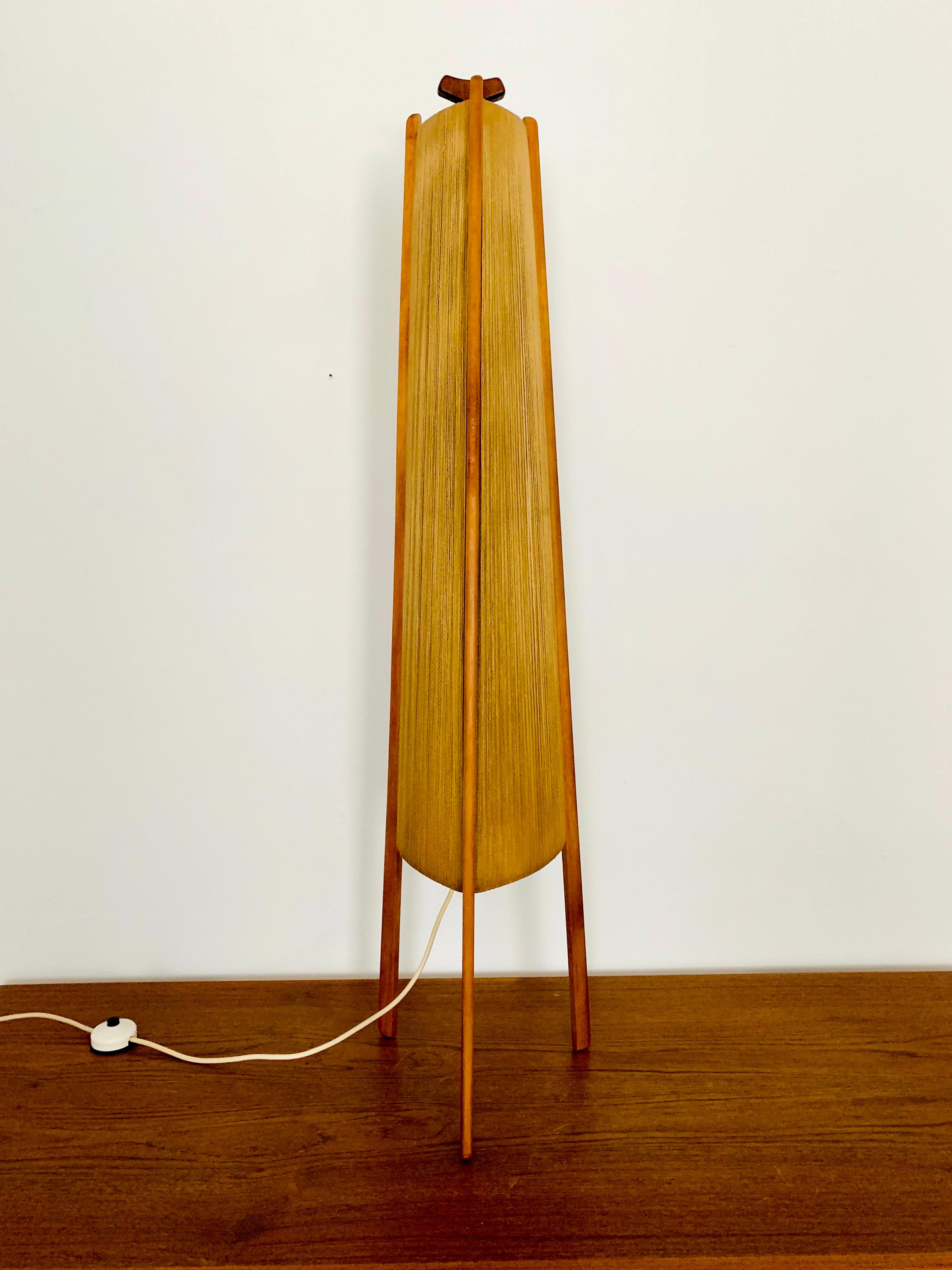 Exceptionally beautiful and very rare floor lamp from the 1960s.
The design was very unusual.
The shape and the materials create a warm and very pleasant light.

Condition:

Very good vintage condition with slight signs of wear.
The Sisal lampshade
