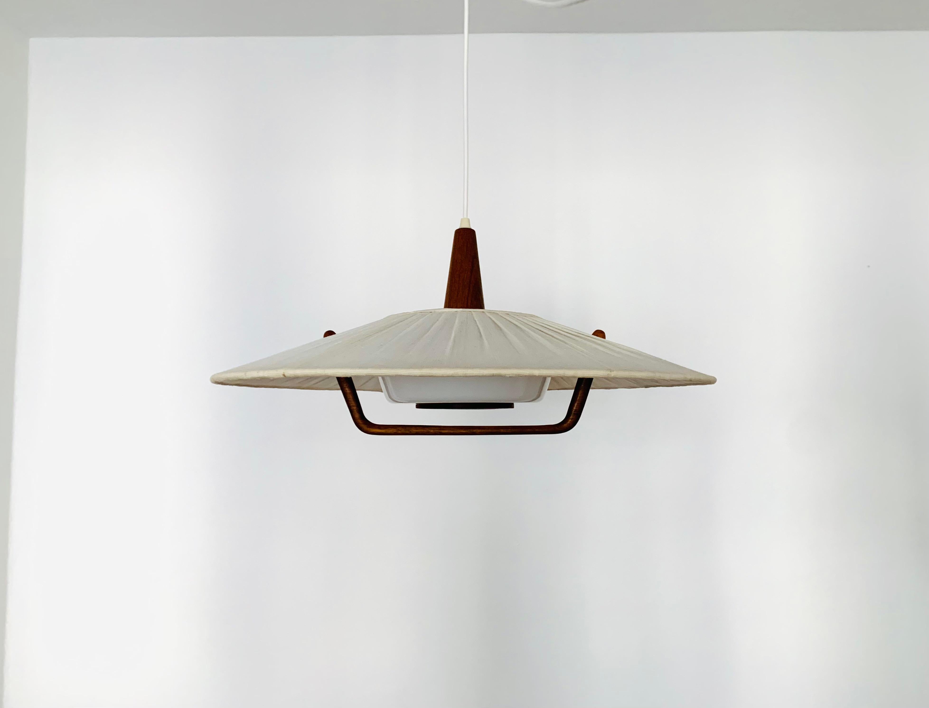 Exceptionally beautiful and large pendant lamp from the 1960s.
The design is very unusual.
The shape and the materials create a warm and very pleasant light.

Condition:

Very good vintage condition with slight signs of wear consistent with