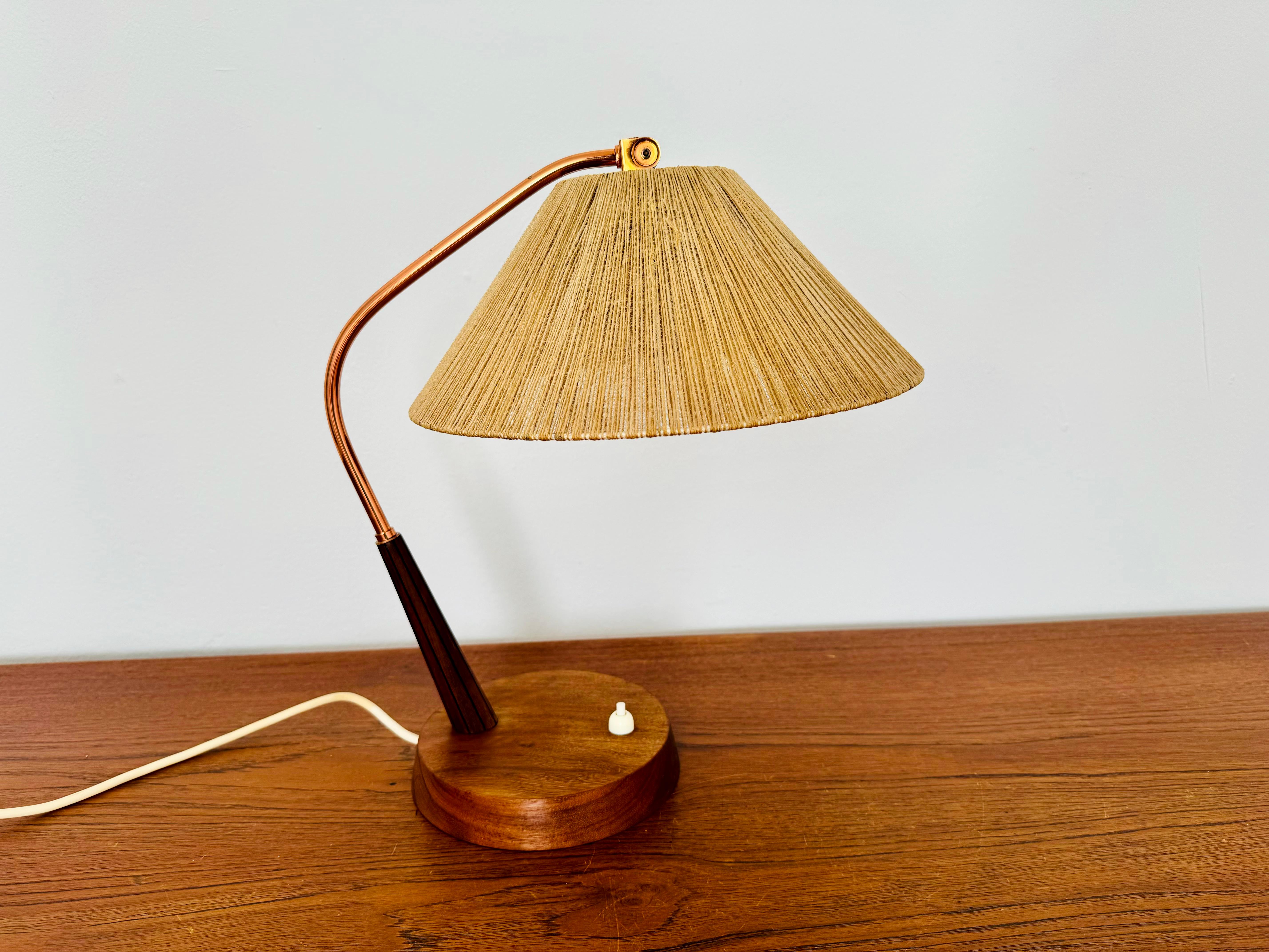 Exceptionally beautiful and very rare table lamp from the 1960s.
The design is very unusual.
The shape and materials create a warm and very pleasant light.

Condition:

Very good vintage condition with slight signs of wear and tear due to age.
The