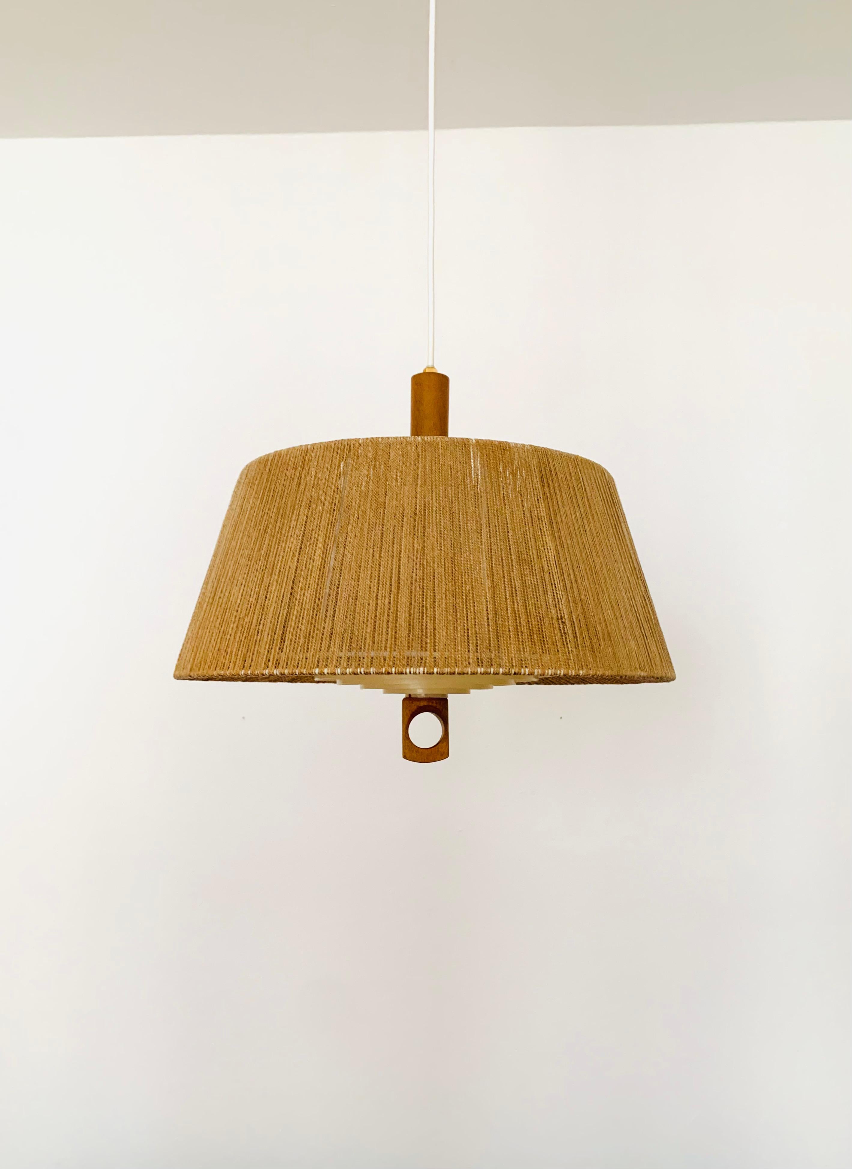 Exceptionally beautiful pendant light from the 1960s.
The design is very unusual.
The shape and the materials create a warm and very pleasant light.

Condition:

Very good vintage condition with slight signs of wear consistent with age.
The