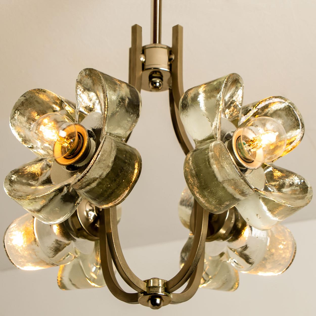 This ceiling light was designed by Simon and Schelle, featuring a rectangular chrome base and four massive glasses in the shape of a four lobed flower. 

Dimensions:
Height 25.2 inch (64cm)
Diameter 15.75 inch (40cm)
 
Very good condition. The