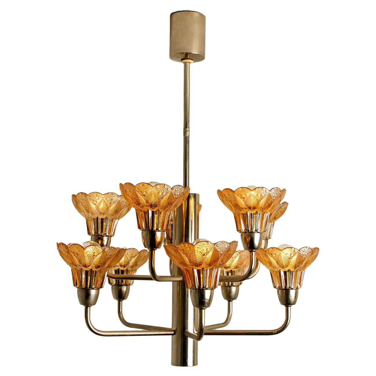 This ceiling light was designed by Simon and Schelle, featuring a rectangular chrome base and four massive glasses in the shape of a four lobed flower. 

Dimensions:
Height only the fixture 13,8 inch (35 cm) overall height 26 inch (66 cm) 
diameter