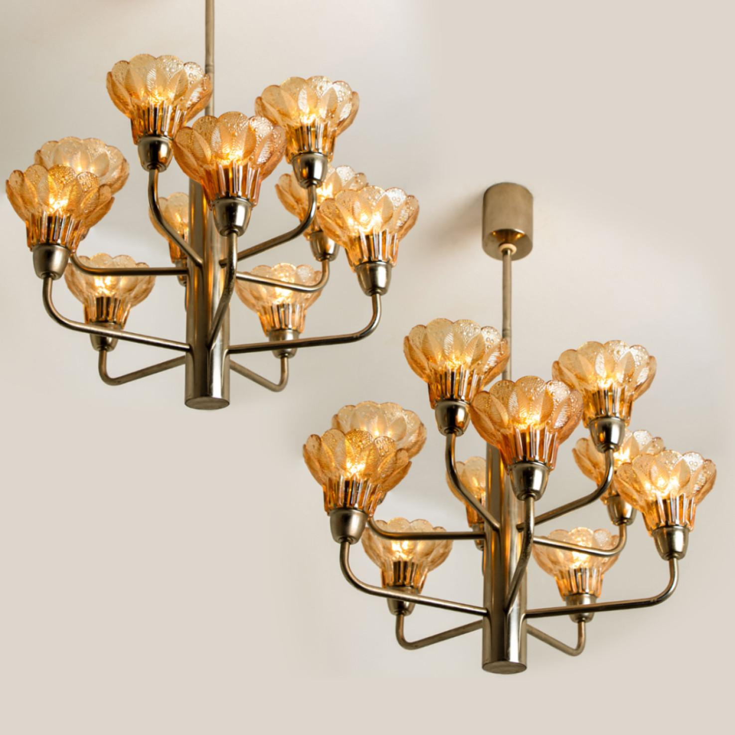 This ceiling light was designed by Simon and Schelle, featuring a rectangular chrome base and four massive glasses in the shape of a four lobed flower.

Dimensions:
Height only the fixture 13,8 inch (35 cm) overall height 26 inch (66 cm)
diameter