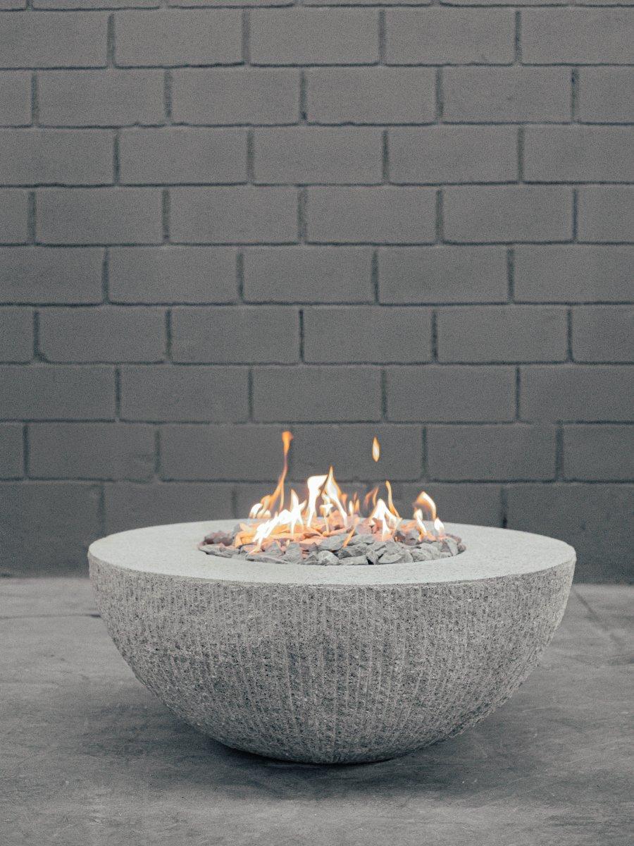Sisifo fire bowl by Andres Monnier 
Dimensions: Diameter 90cm x height 55cm
Materials: Stainless steel. Quarry stone.
Technique: Hand-crafted. A mix of polished and unfinished looks. 

Sisifo fire bowl is a piece inspired by the myth of