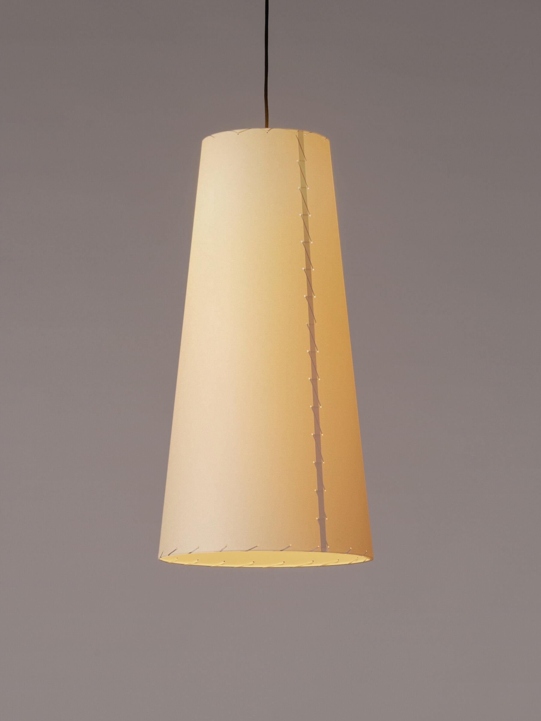 Sísísí Cónicas Largas GT4 pendant lamp by Gabriel Ordeig Cole
Dimensions: D 40 x H 80 cm
Materials: metal, stitched parchment.

The GT4 and MT2 lamps consist of a conical shade made of stitched cardboard, to be repeated in spaces where a warm