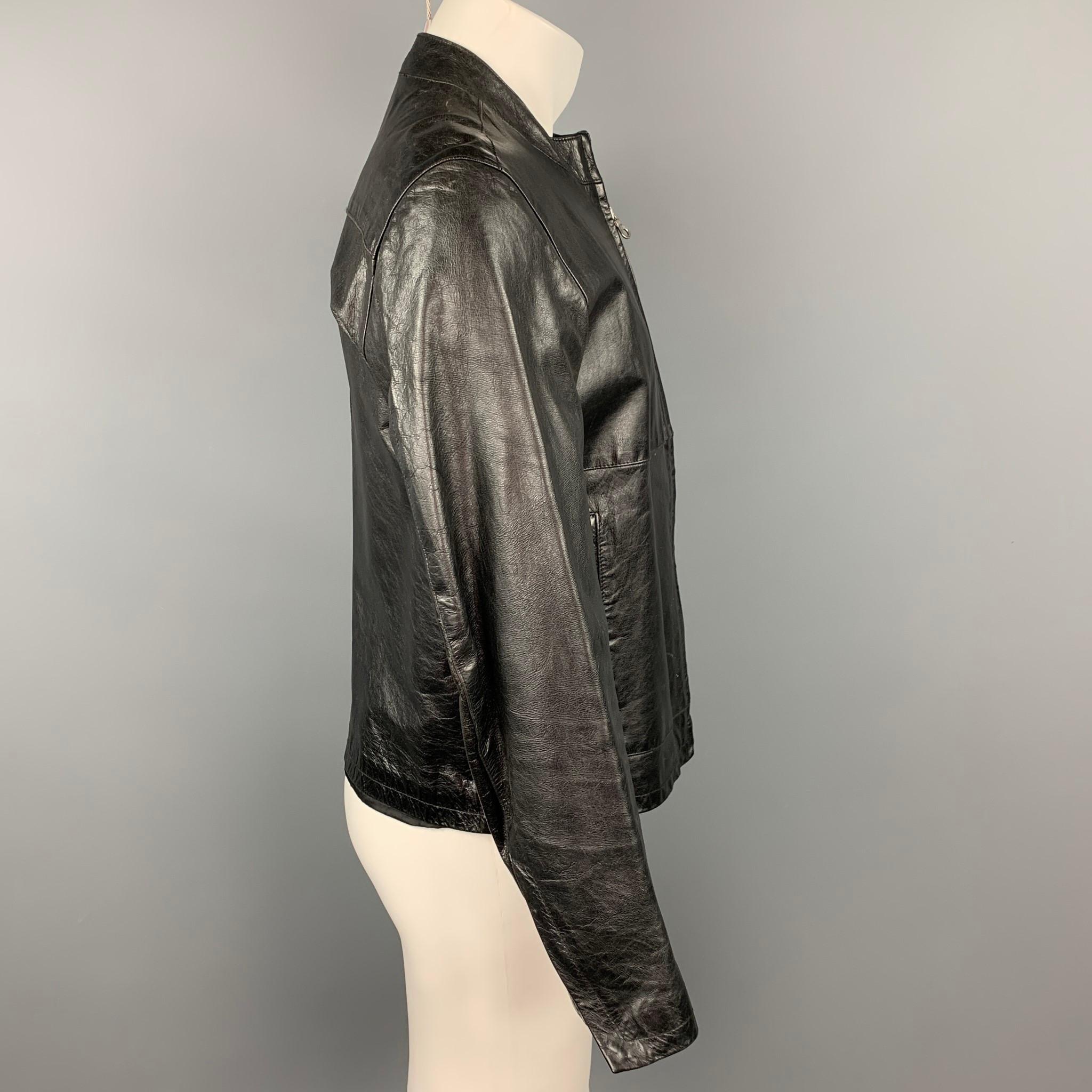 SISLEY jacket comes in a black leather with a full liner featuring top stitching, slit pockets, and a fill zip up closure. Made in Romania. 

Very Good Pre-Owned Condition.
Marked: 48

Measurements:

Shoulder: 18.5 in.
Chest: 41 in.
Sleeve: 24