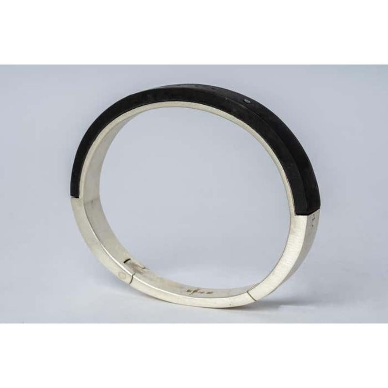 Bracelet in sterling silver and blackened bronze. The Sistema series expresses the core principle of P/4 which is modularity. The 