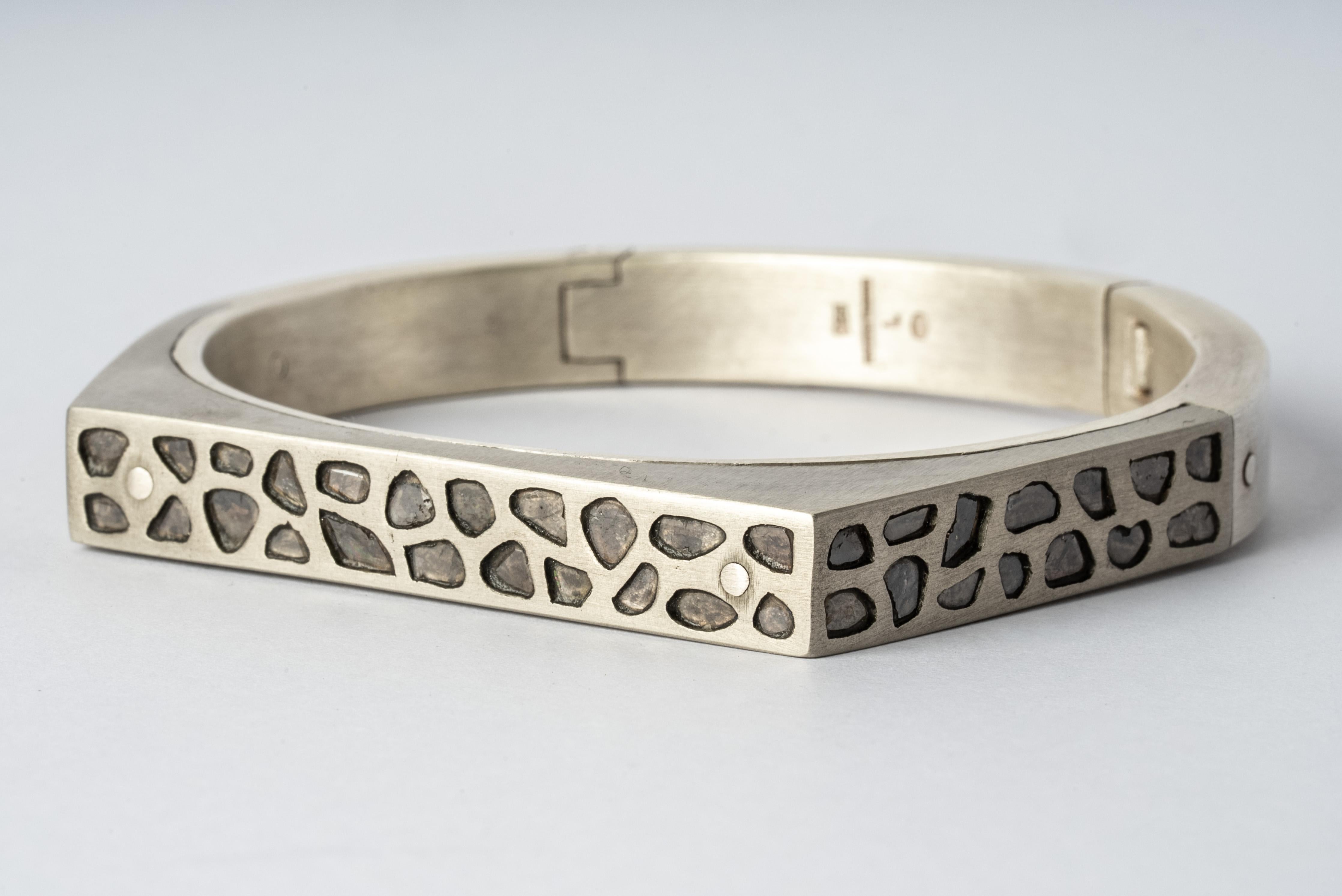 Bracelet in sterling silver, bronze and slabs of rough diamond set in mega pave setting. These slabs are removed from a larger chunk of diamond. This item is made with a naturally occurring element and will vary from the photograph you see. Each