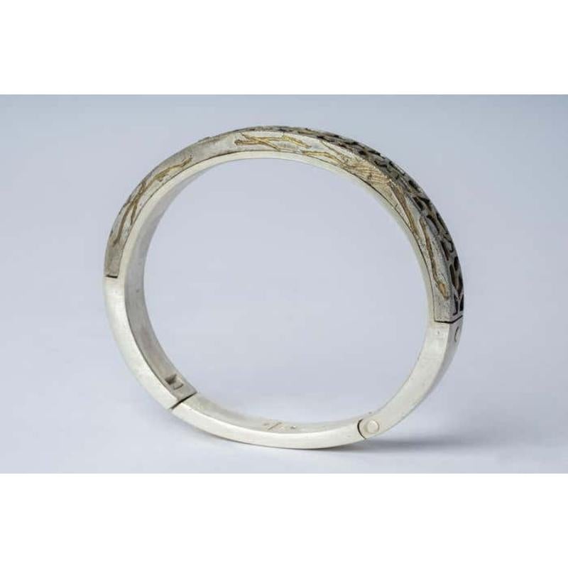 Bracelet in sterling silver, burned gold plated brass and slabs of rough diamond set in mega pave setting. These slabs are removed from a larger chunk of diamond. This item is made with a naturally occurring element and will vary from the photograph